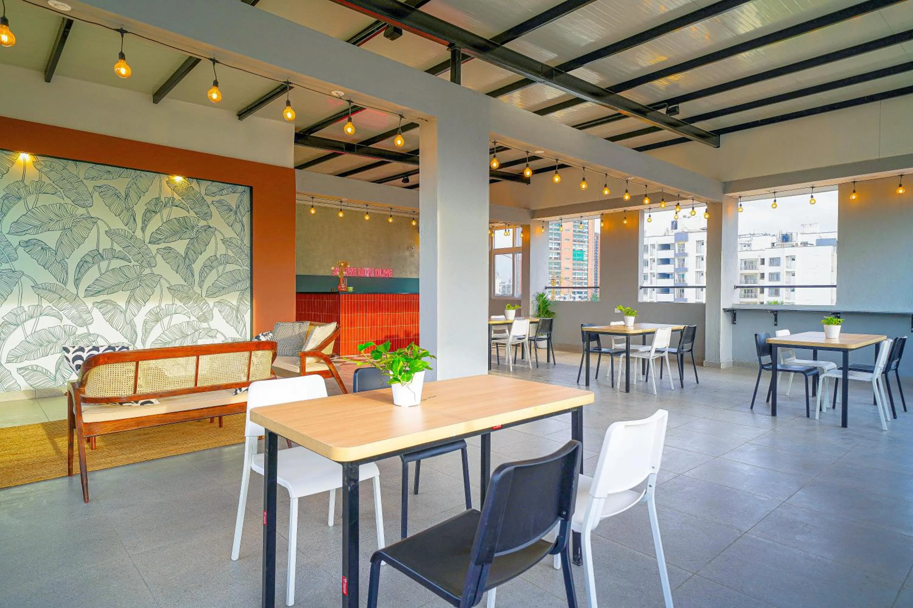 Seating area in Olive Hotel Hoodi by Embassy Group