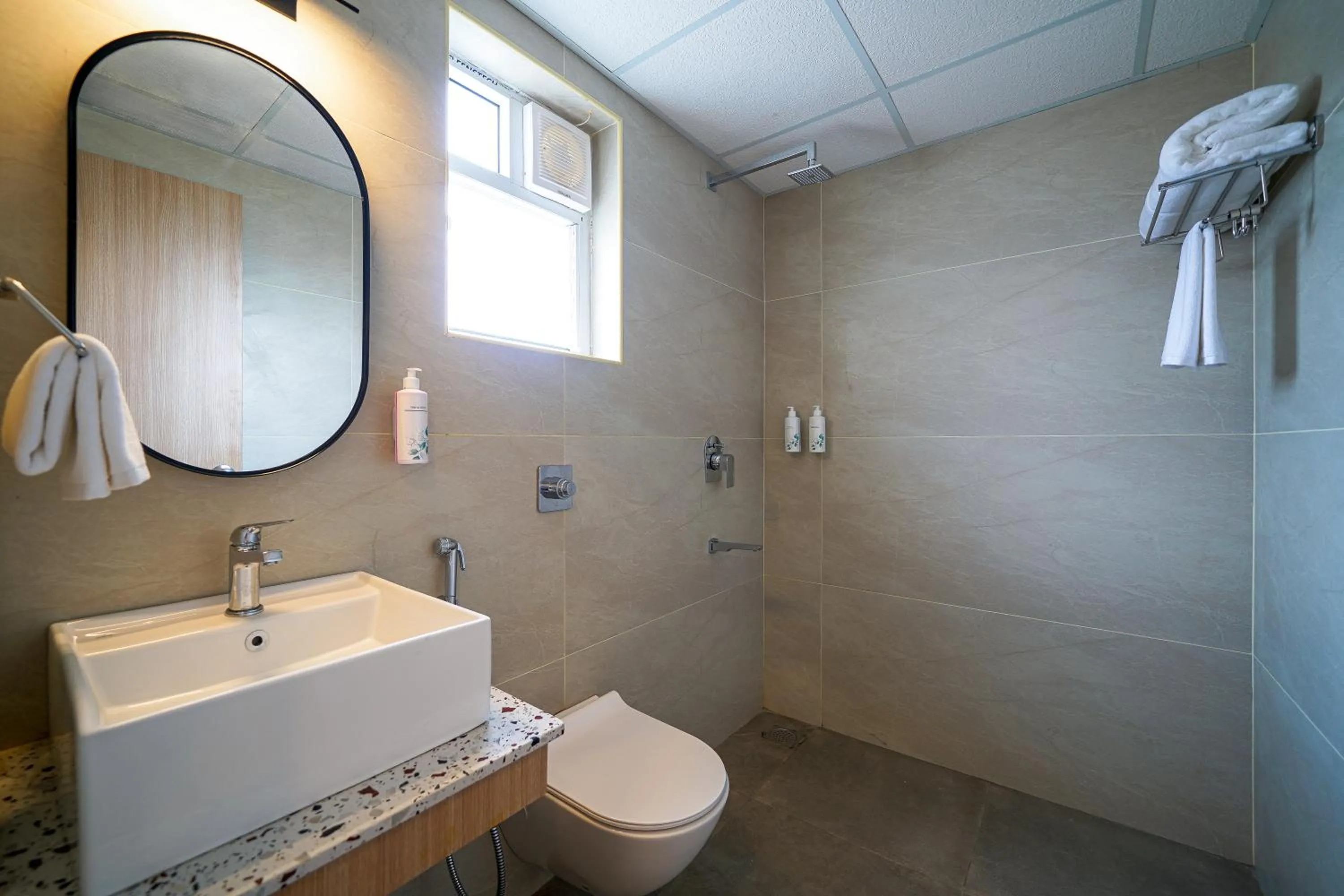 Bathroom in Olive Hotel Hoodi by Embassy Group