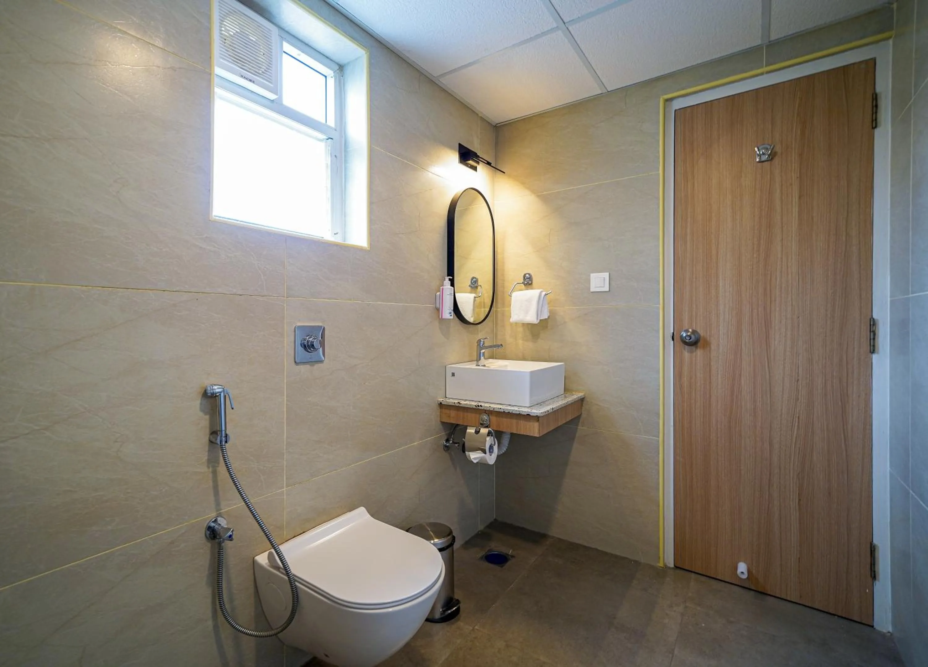 Bathroom in Olive Hotel Hoodi by Embassy Group