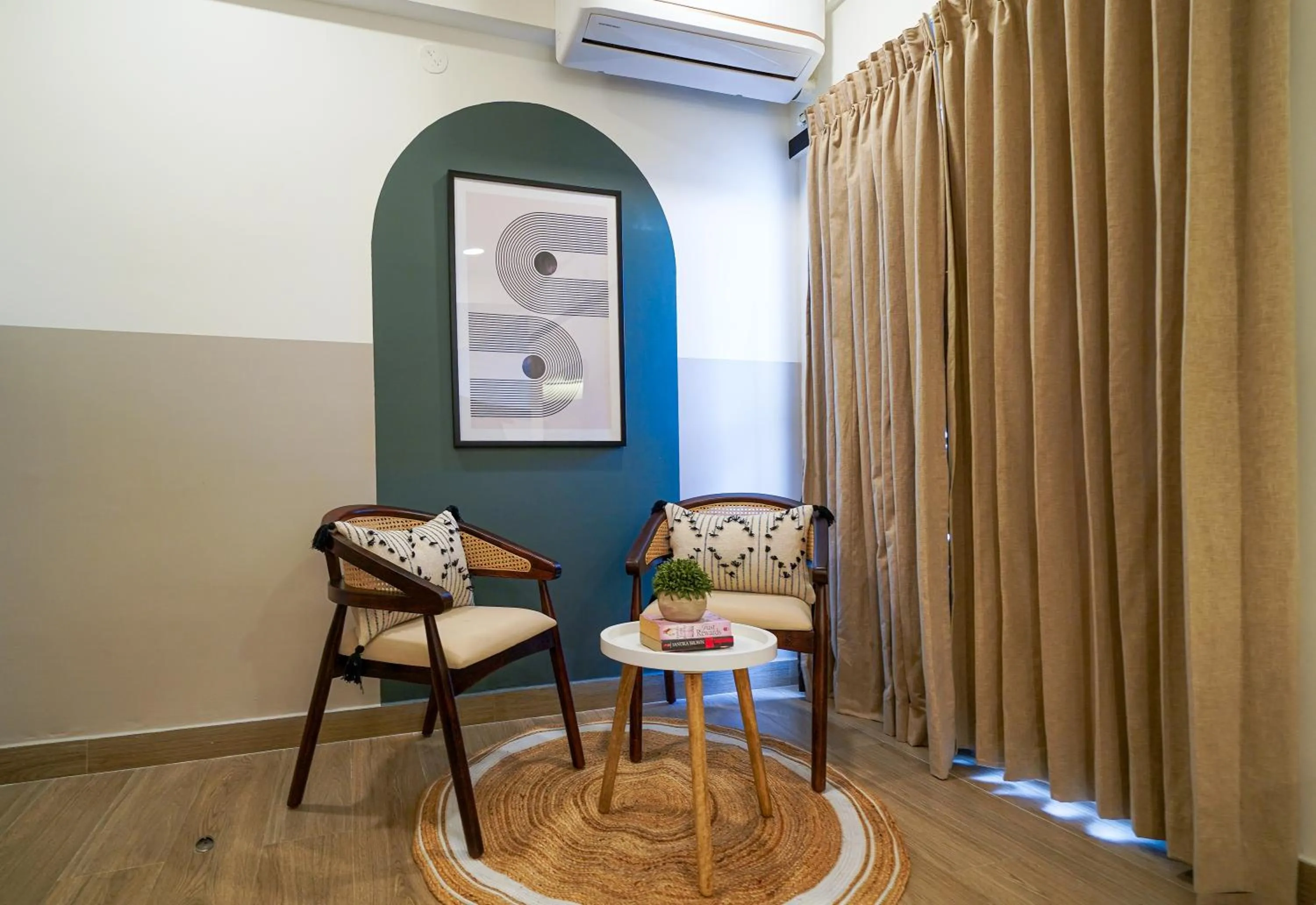 Seating area in Olive Hotel Hoodi by Embassy Group