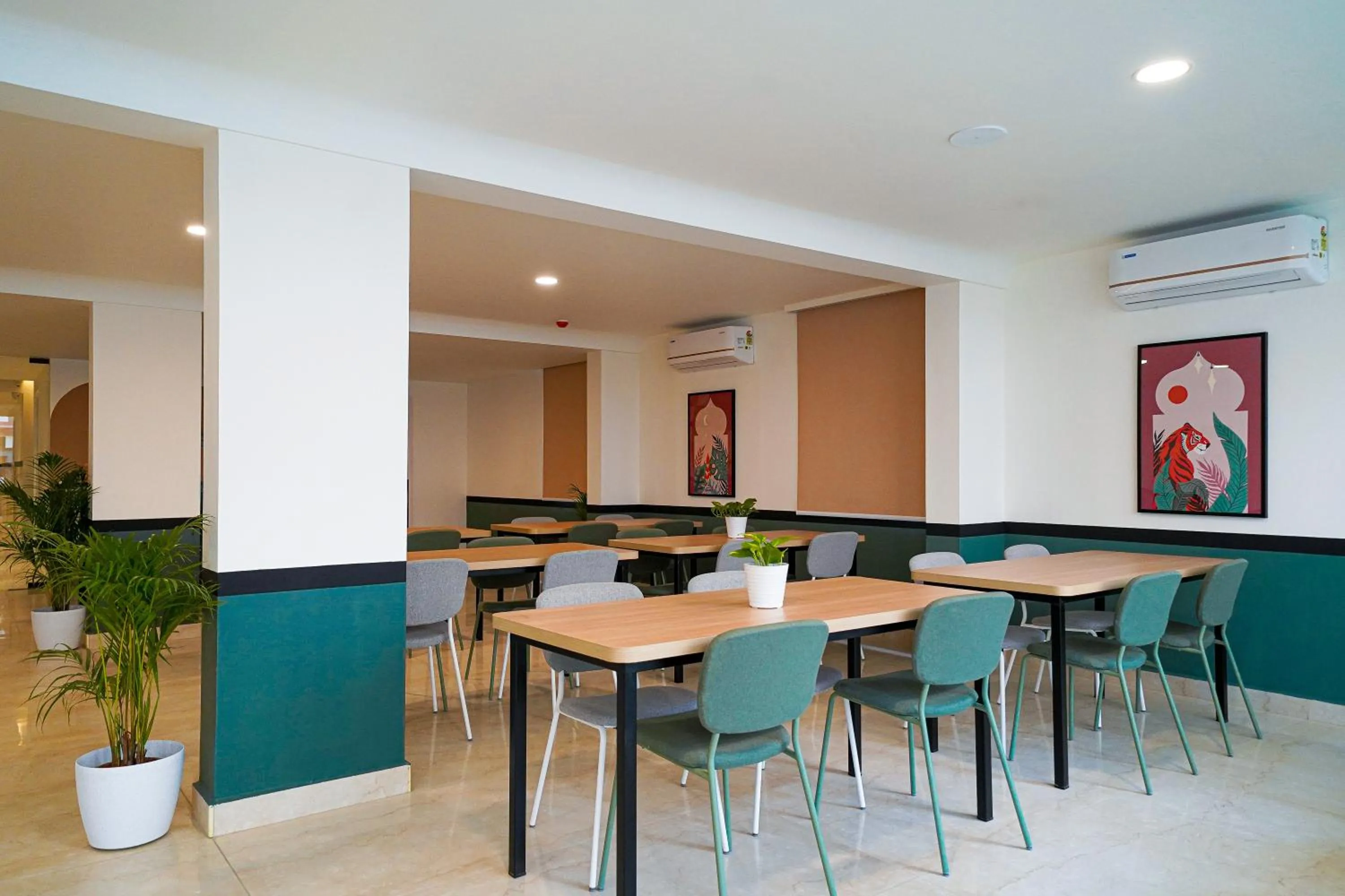 Seating area in Olive Hotel Hoodi by Embassy Group