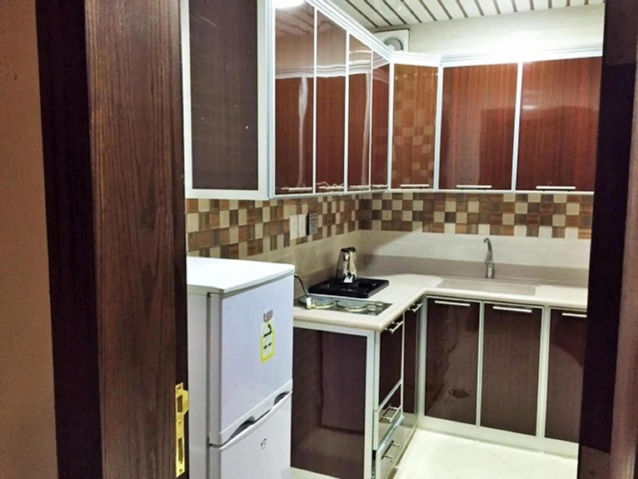 Kitchen or kitchenette in Hona Al Holm Furnished Units