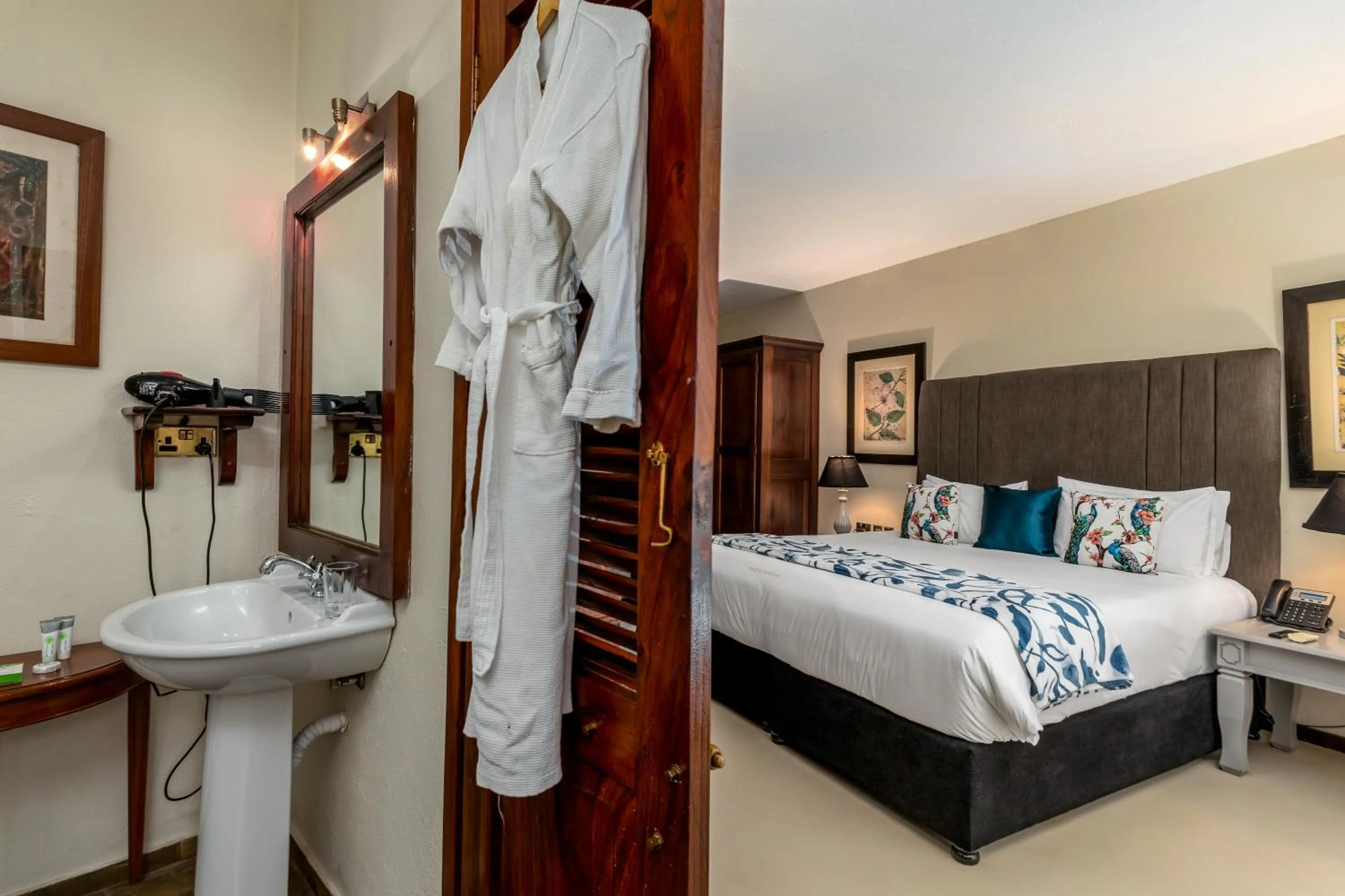 Bathroom, Bed in The Emin Pasha Hotel & Spa Kampala