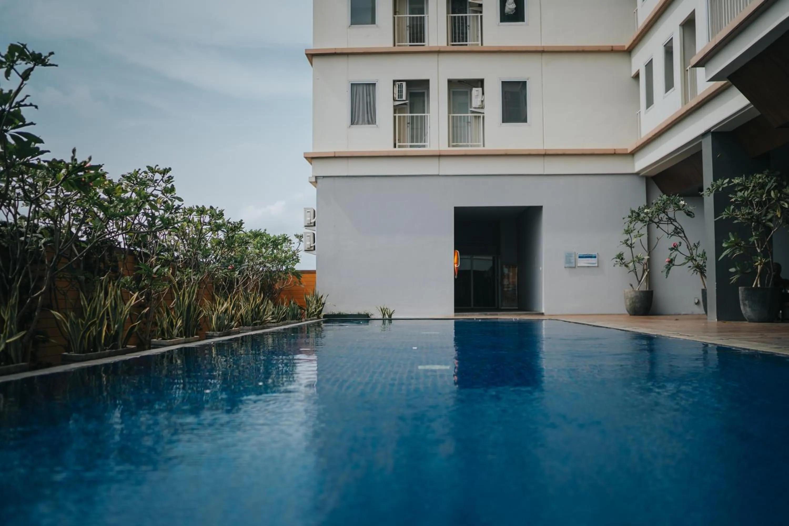 Pool view in Tmansari Mahogany Apartement By Cozy