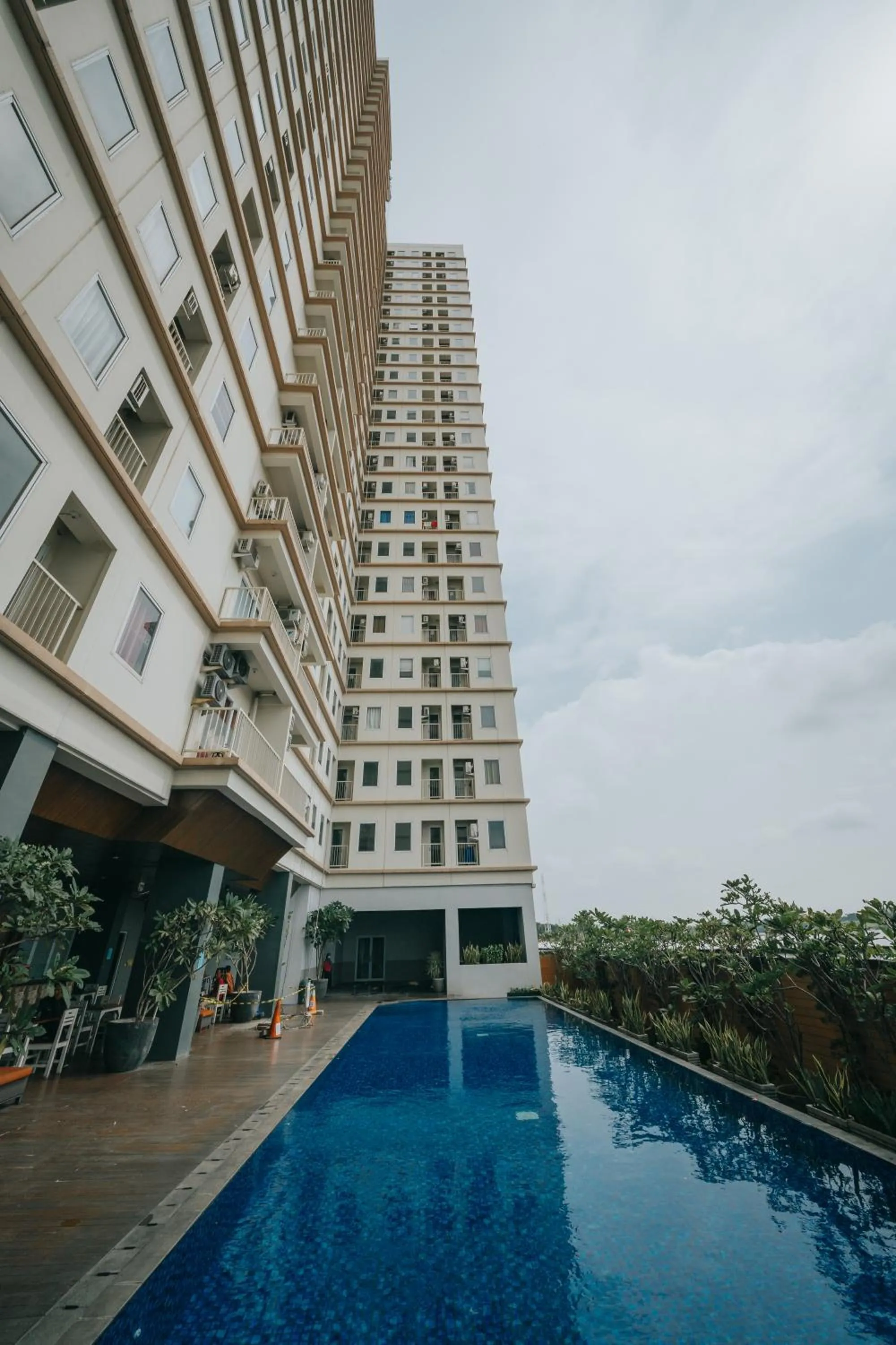 Swimming pool in Tmansari Mahogany Apartement By Cozy