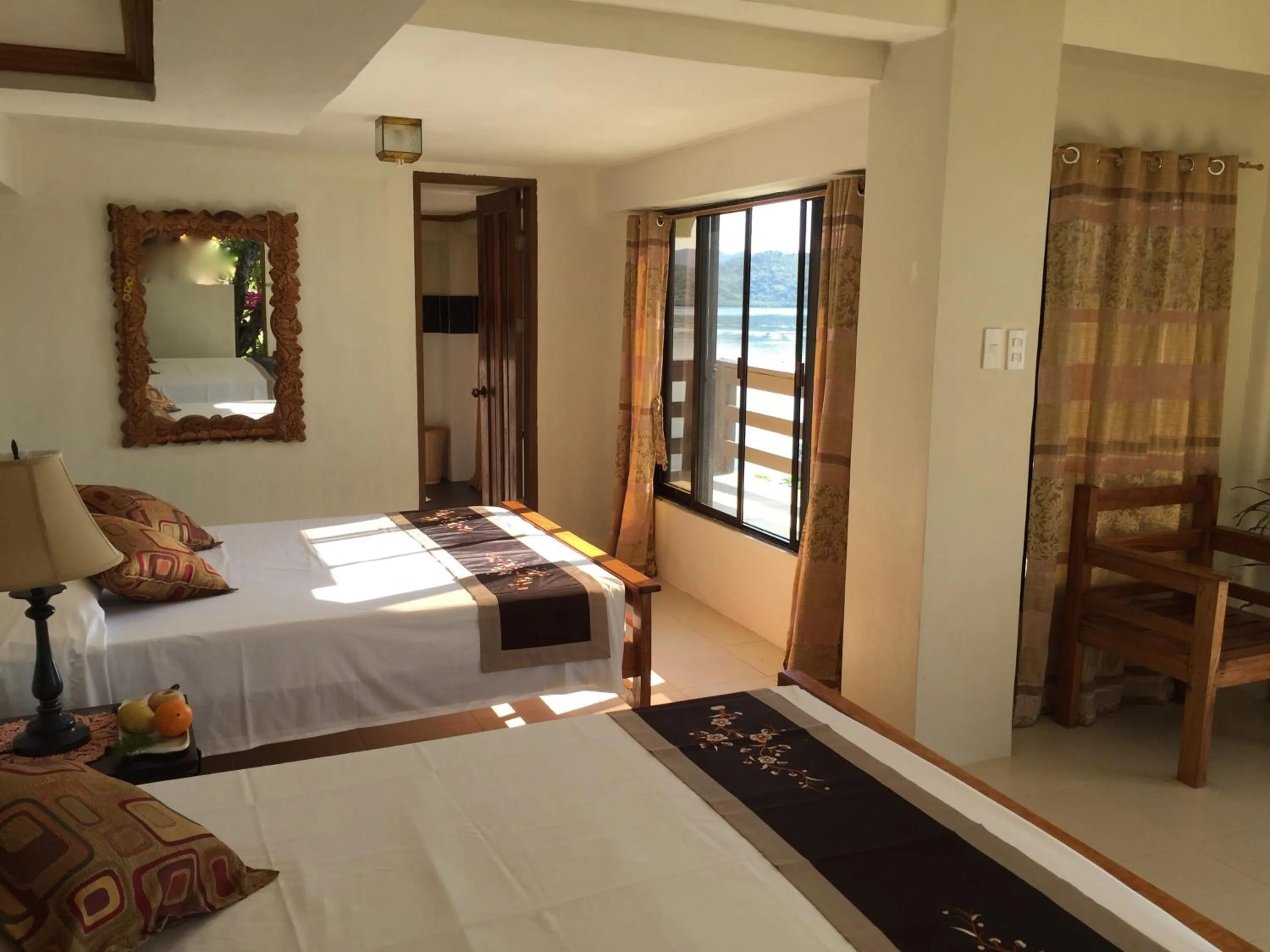 Photo of the whole room, Bed in La Estancia Busuanga