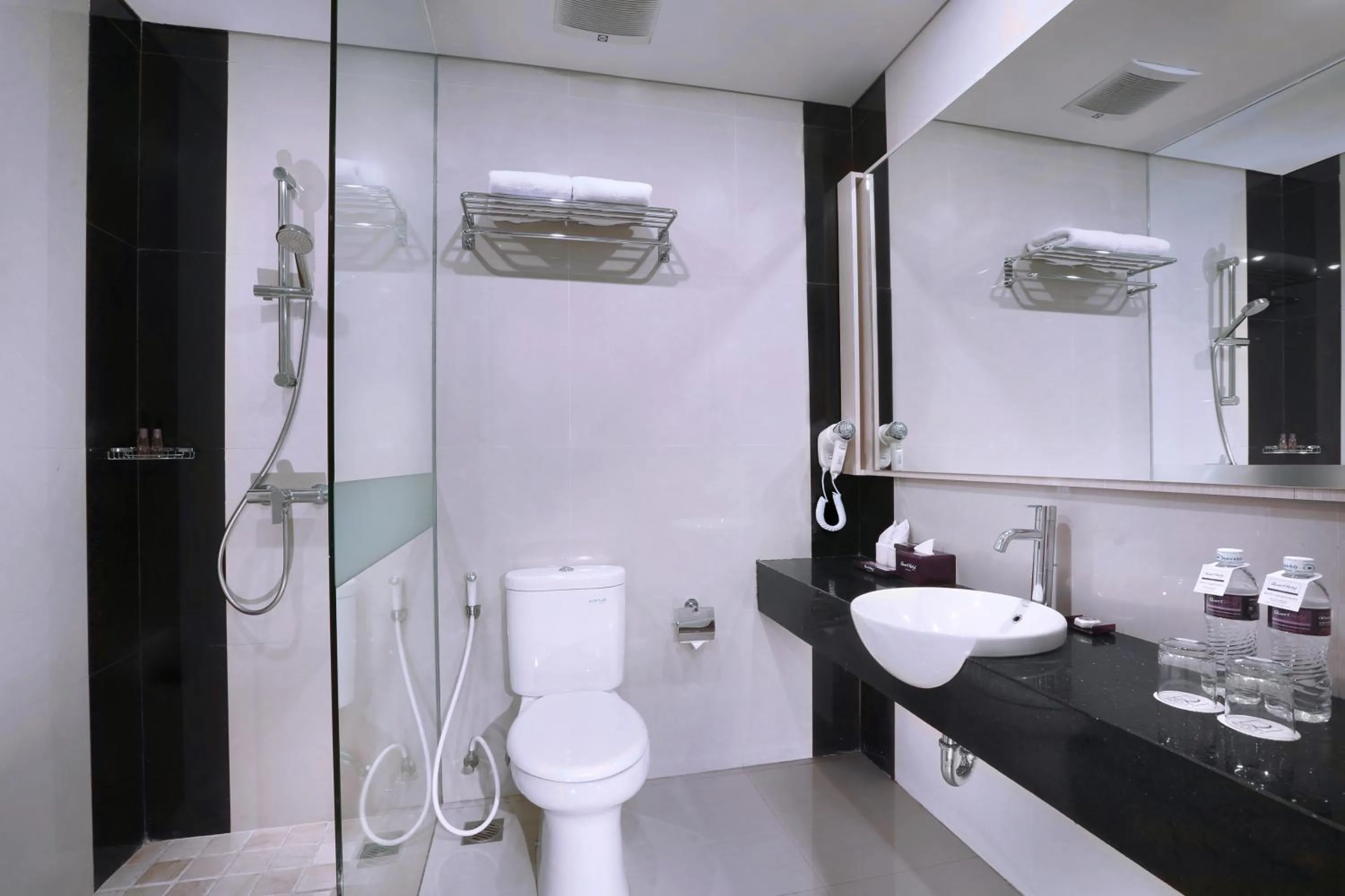 Bathroom in Quest San Denpasar by ASTON