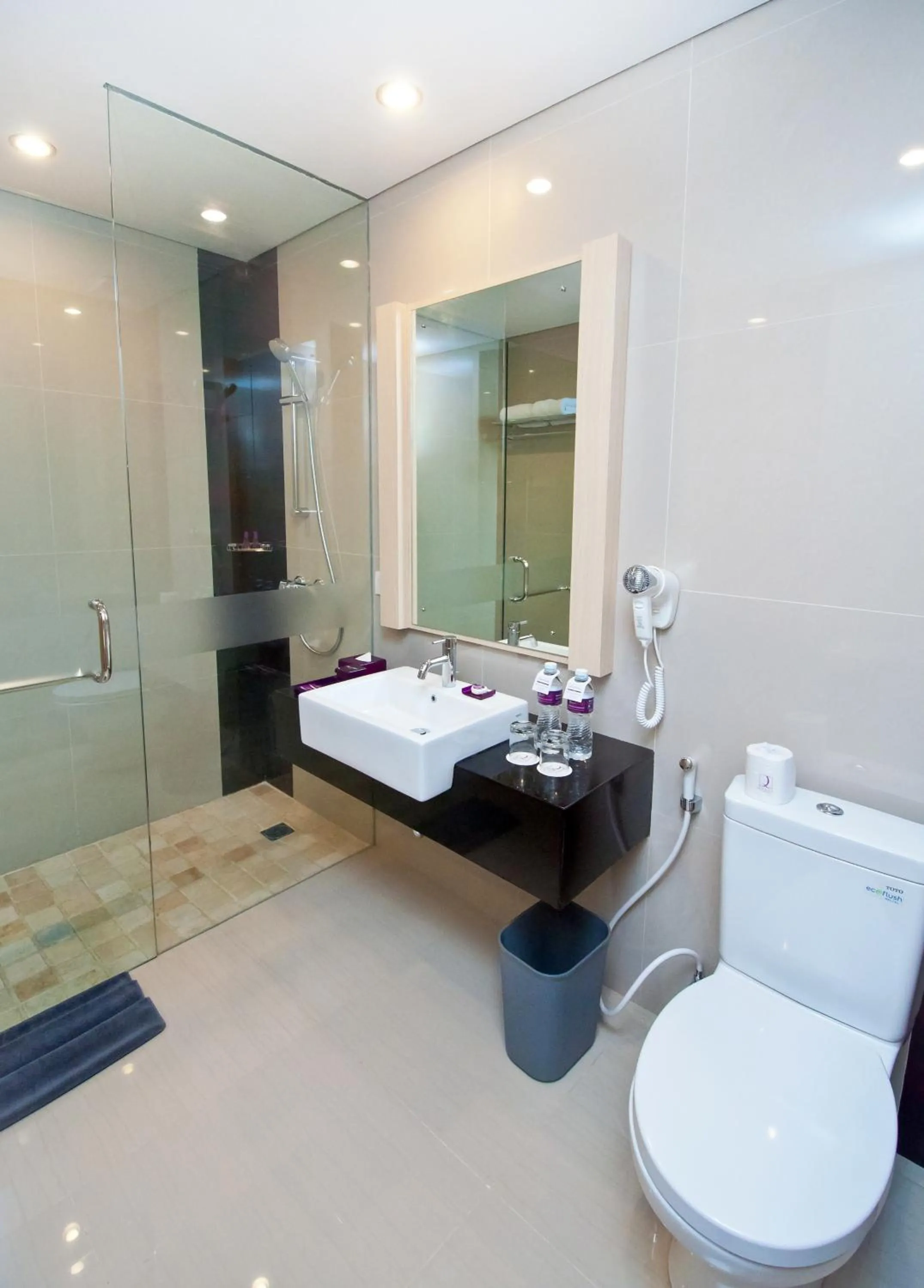 Bathroom in Quest San Denpasar by ASTON