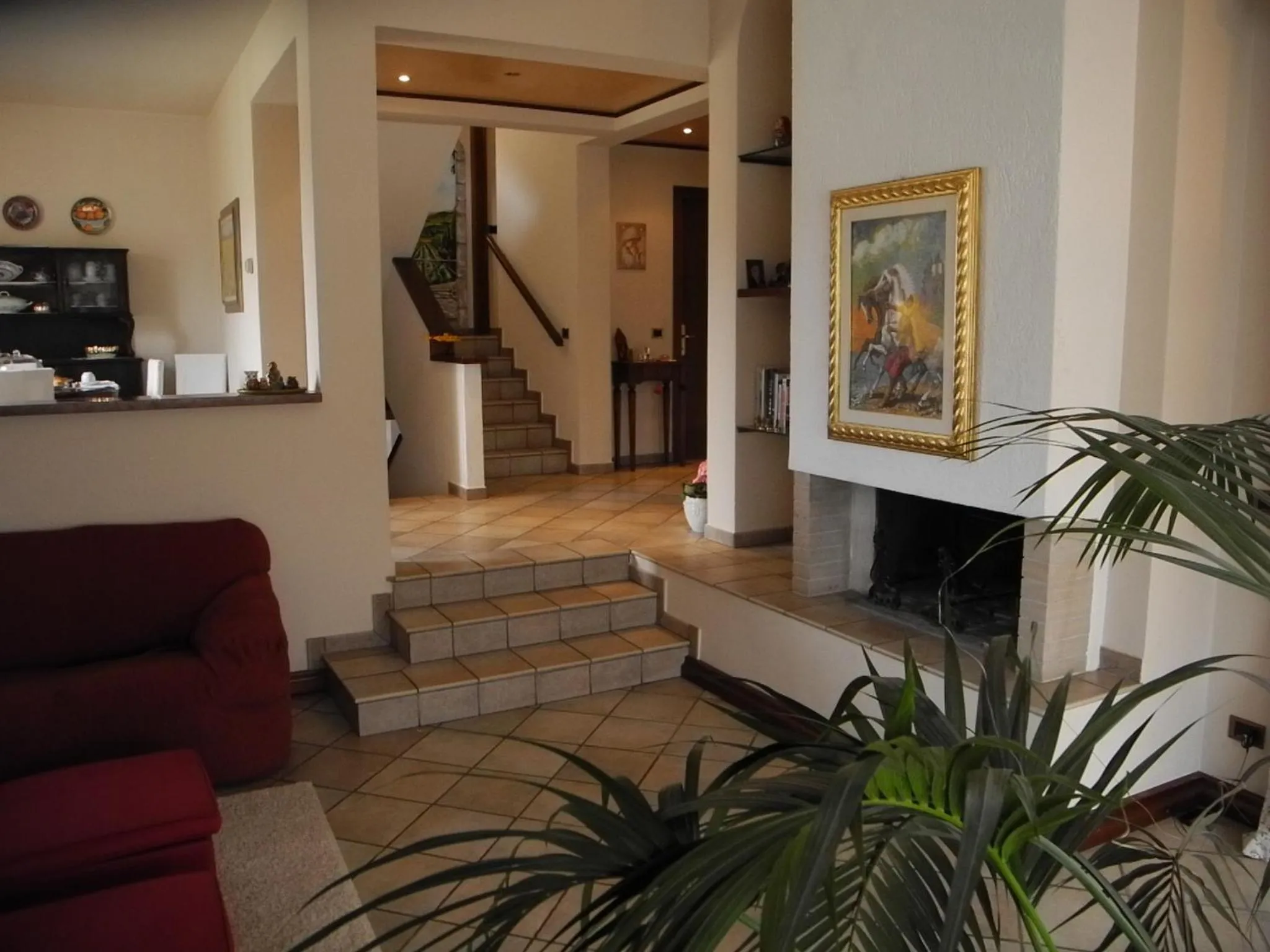 Communal lounge/ TV room in Villa Campo dei Fiori