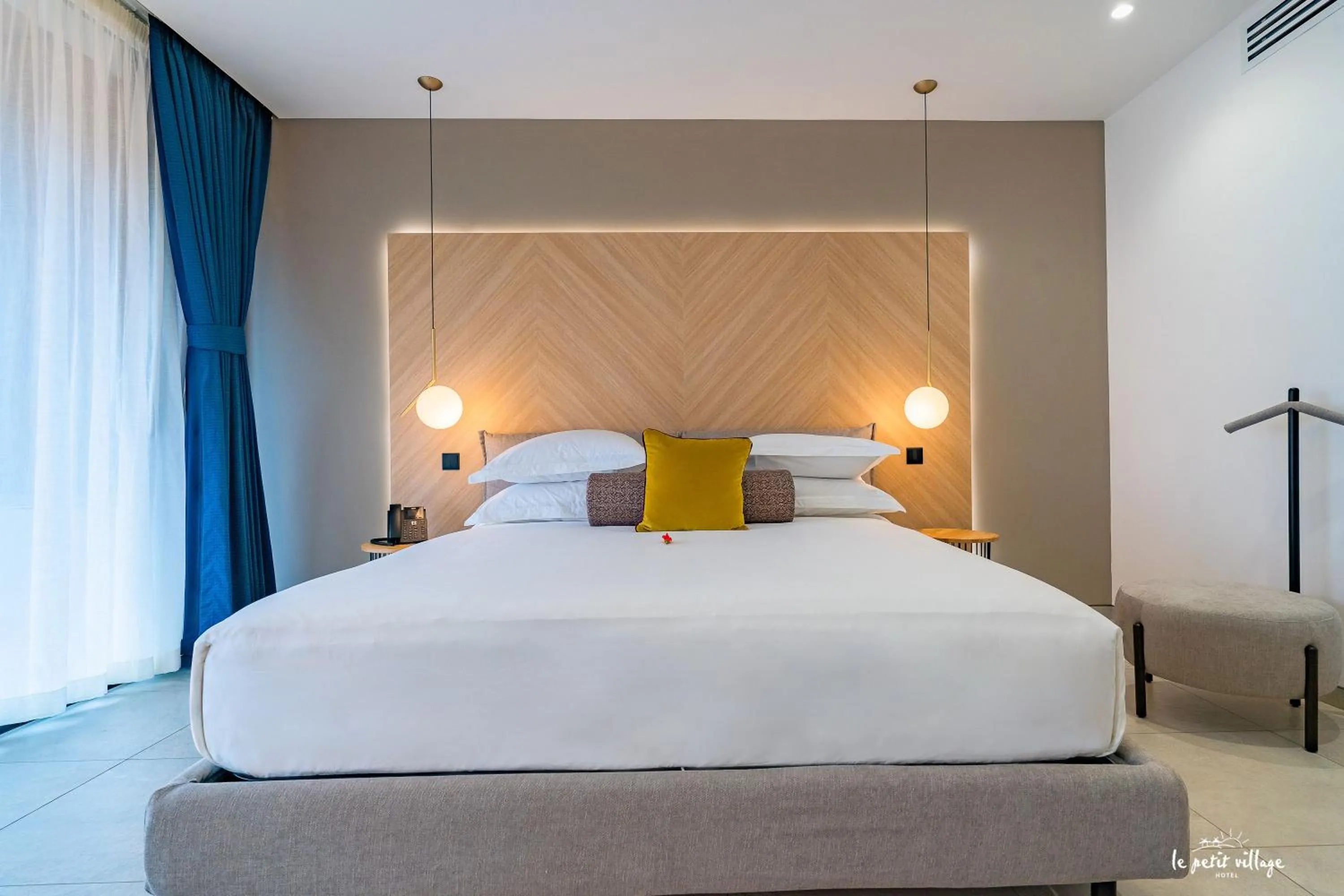 Bed in Le Petit Village Boutique Hotel & Spa