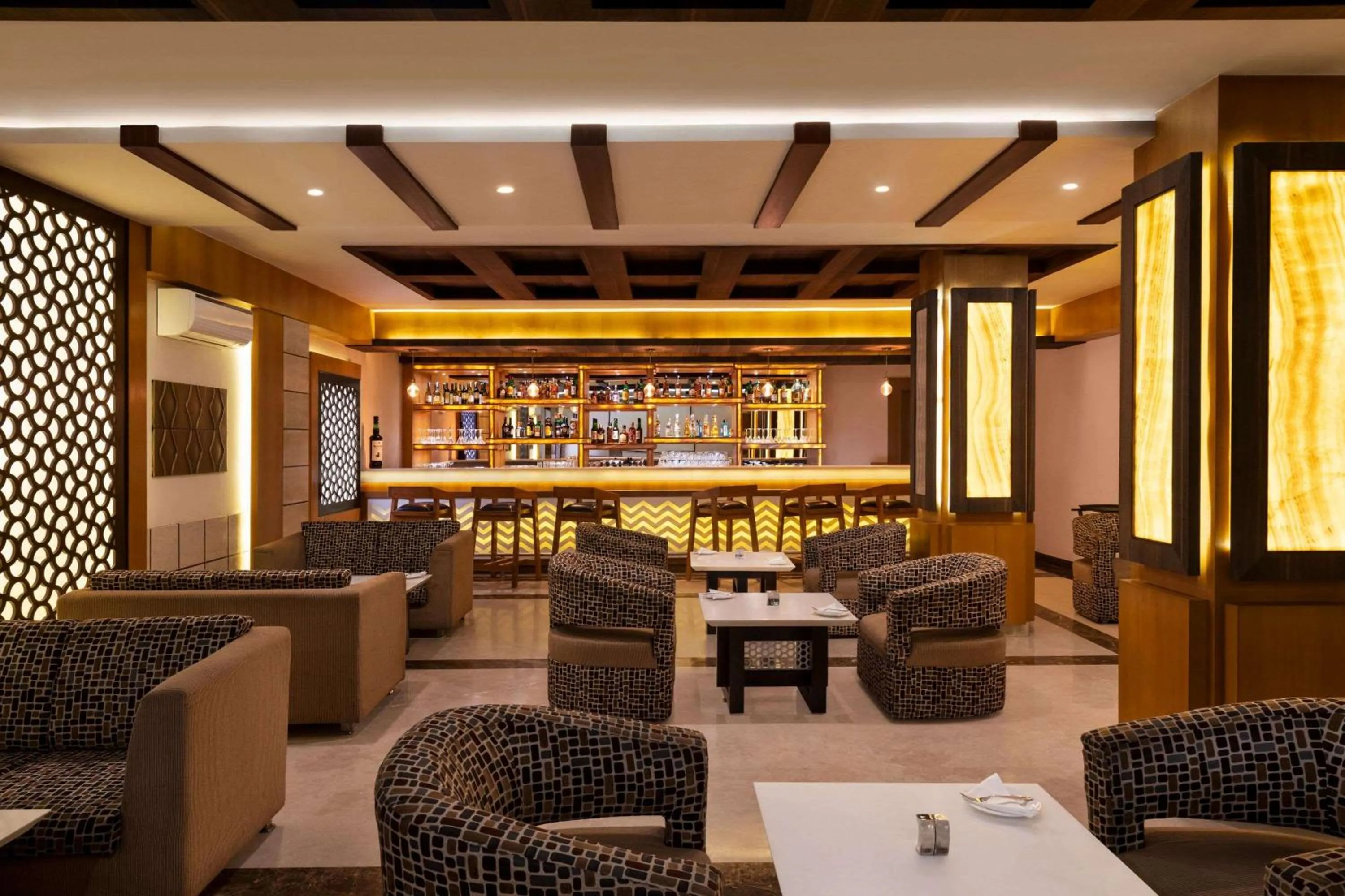 Lounge or bar in Ramada by Wyndham Varanasi Katesar