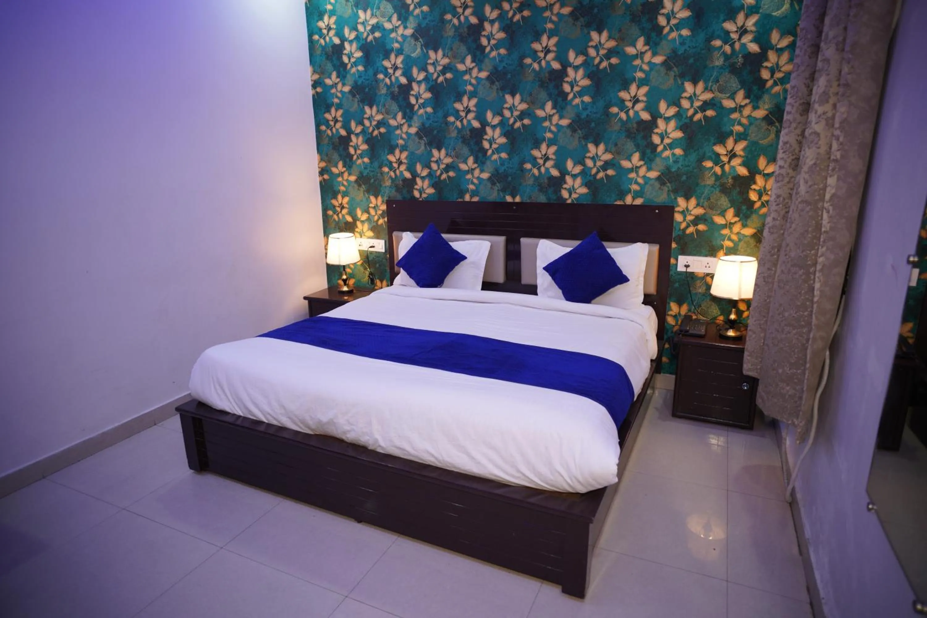 Bed in Blue Sky Hotels and Banquet