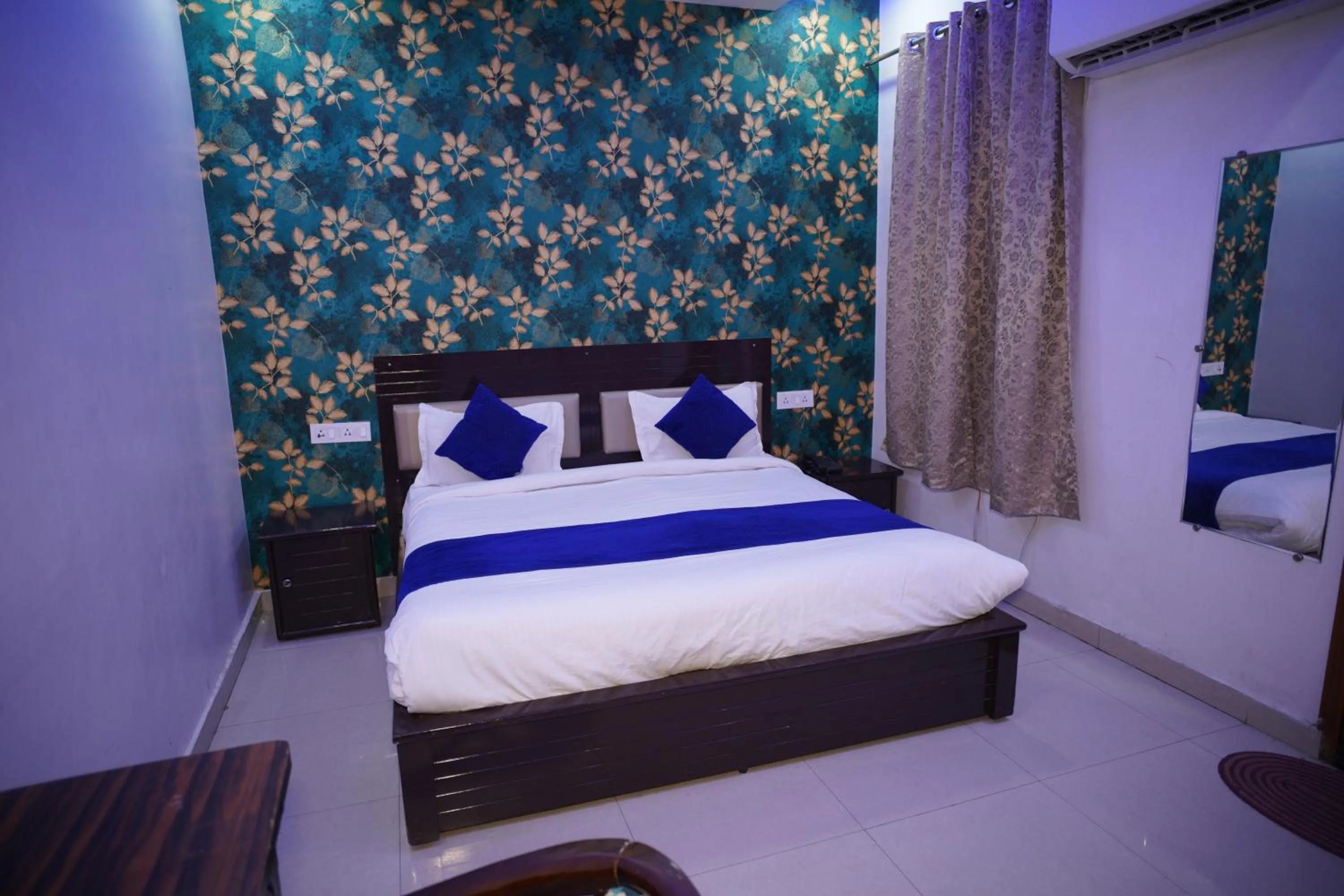 Bed in Blue Sky Hotels and Banquet
