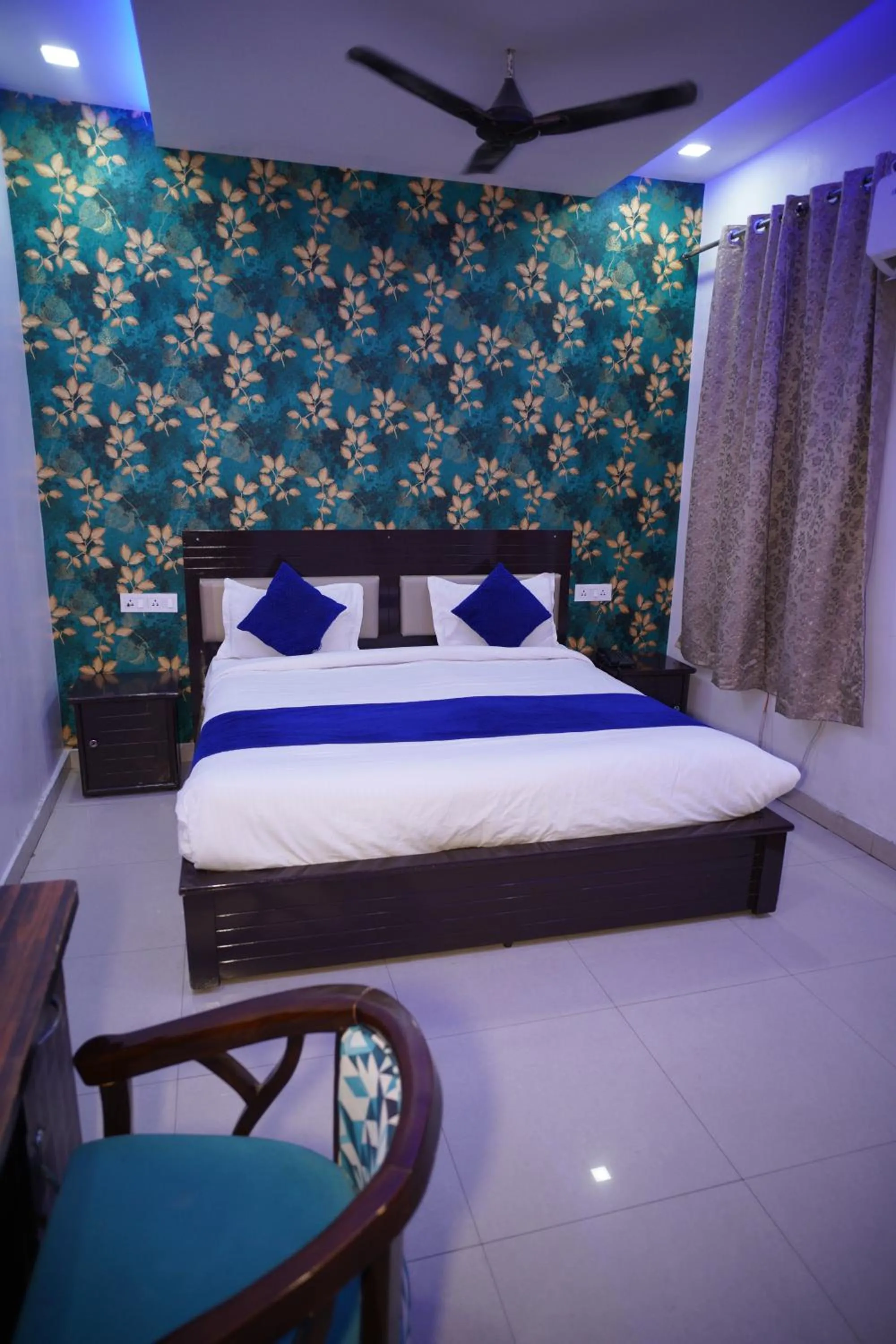 Bed in Blue Sky Hotels and Banquet