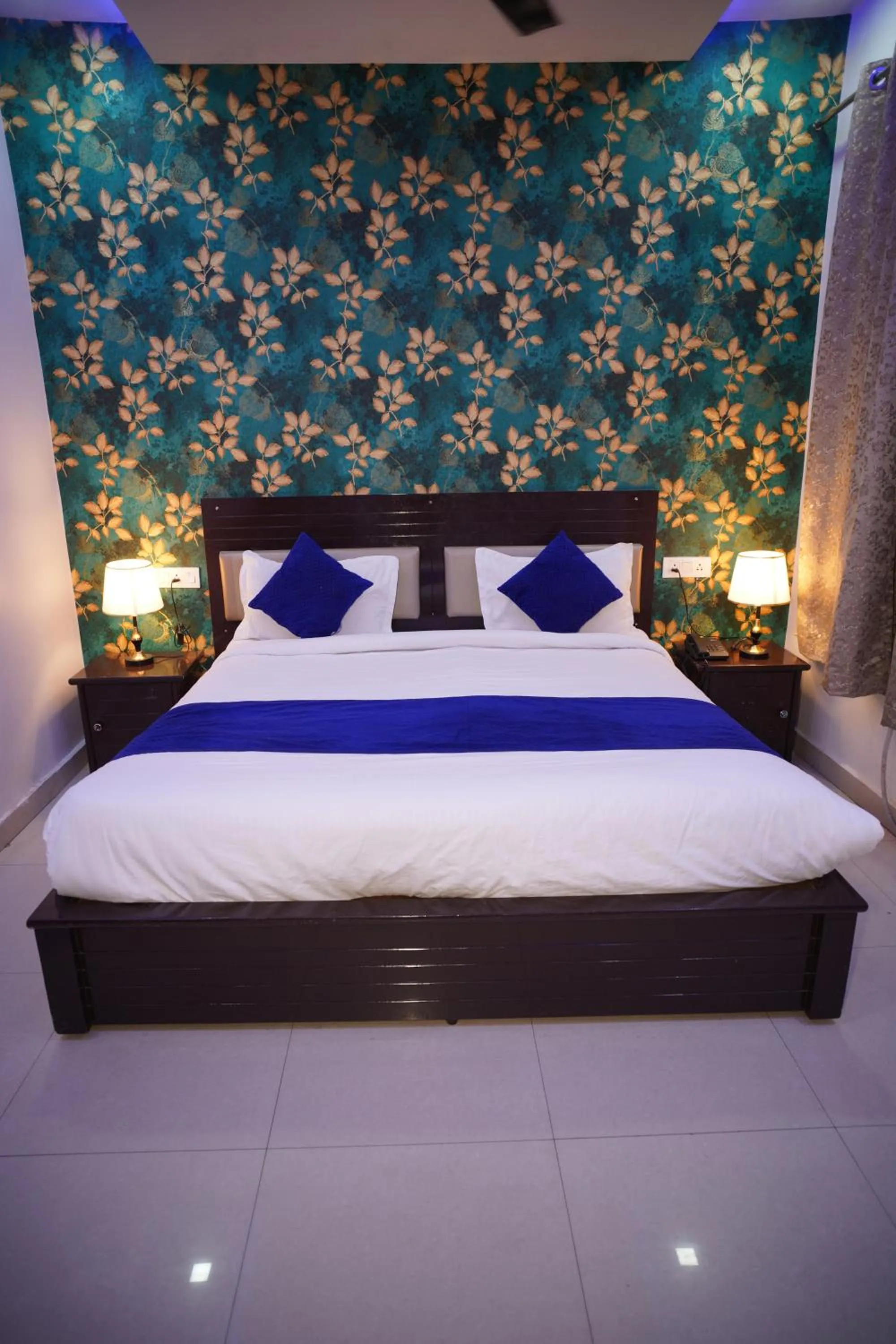 Bed in Blue Sky Hotels and Banquet
