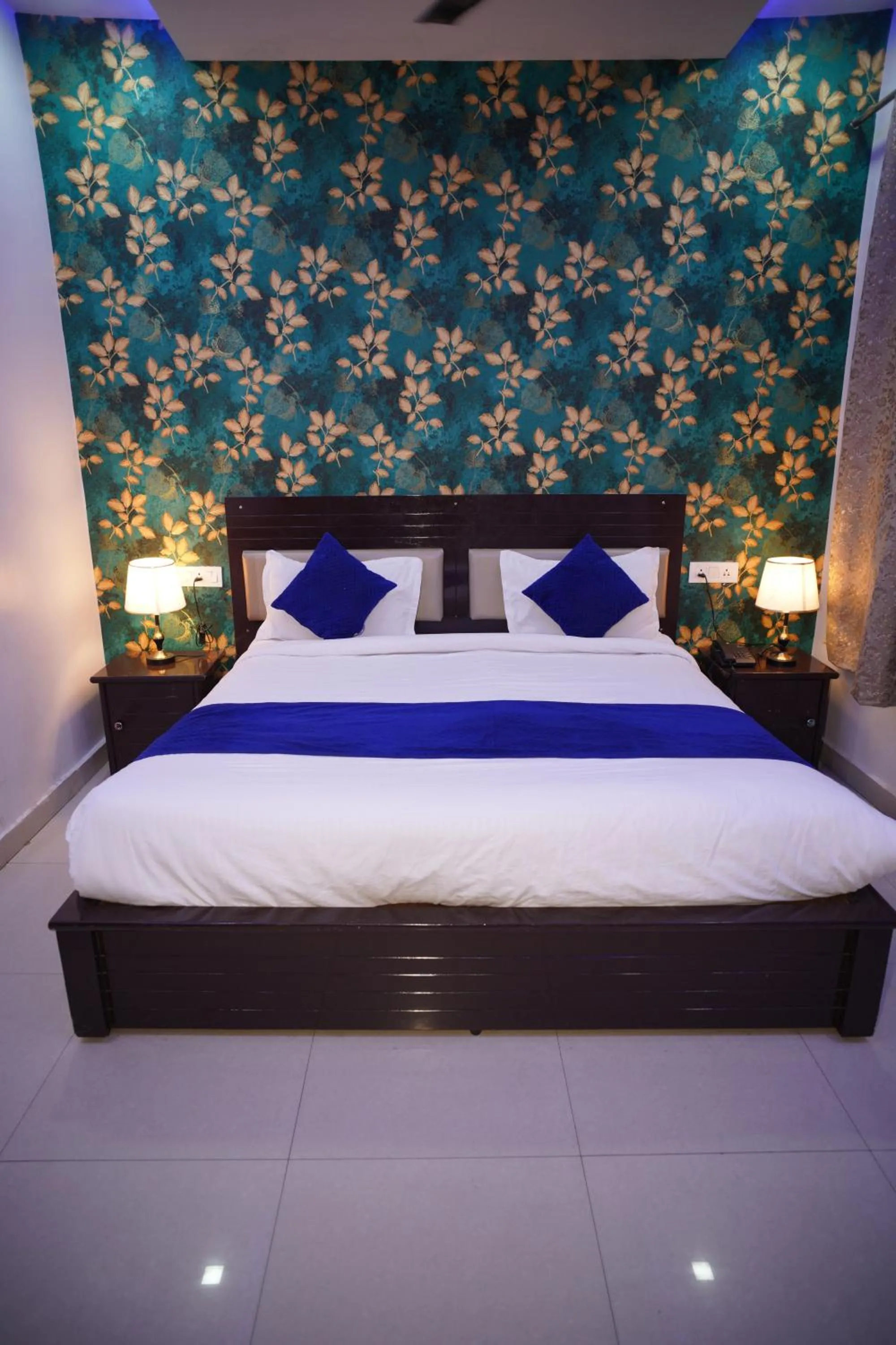 Bed in Blue Sky Hotels and Banquet