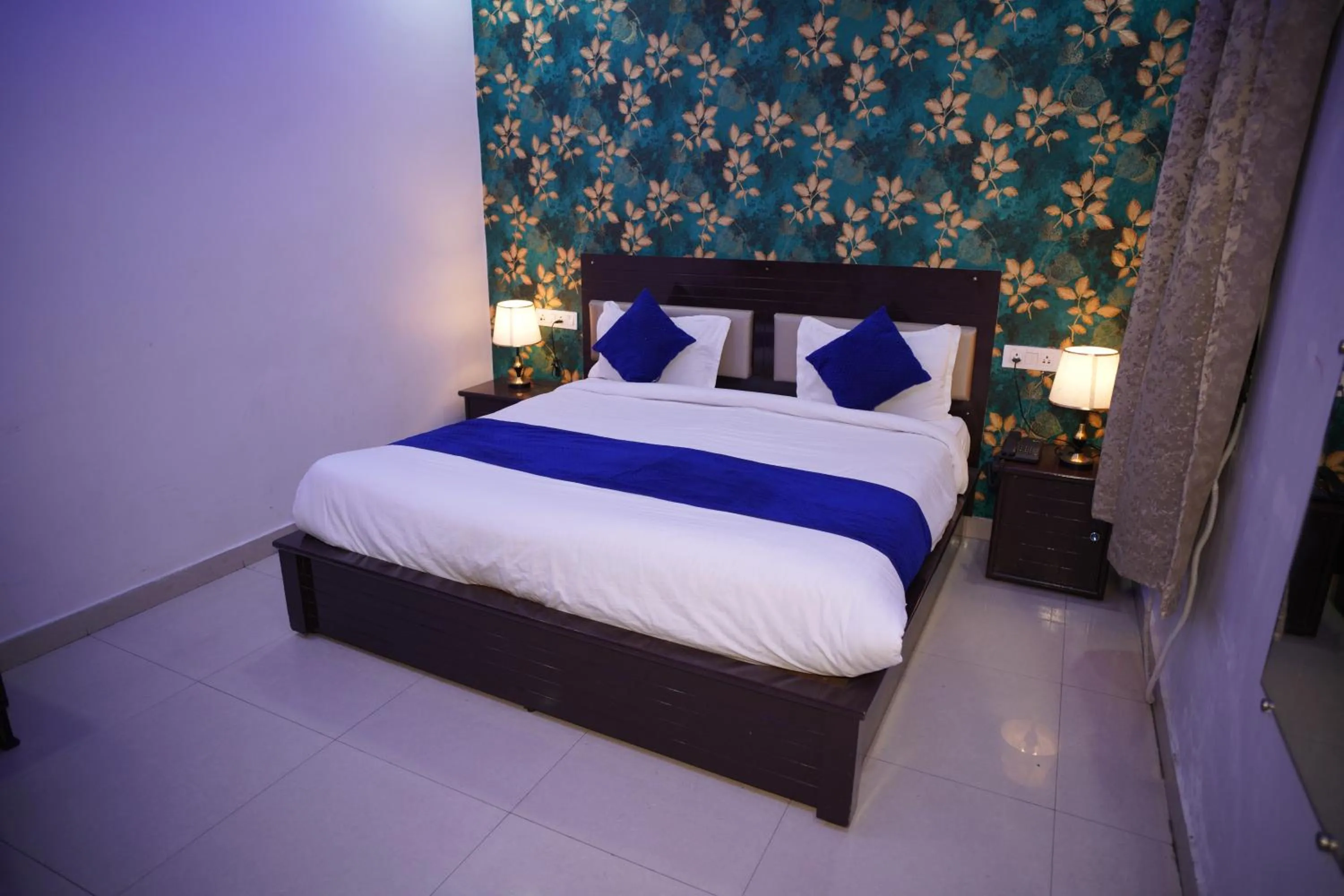 Bed in Blue Sky Hotels and Banquet