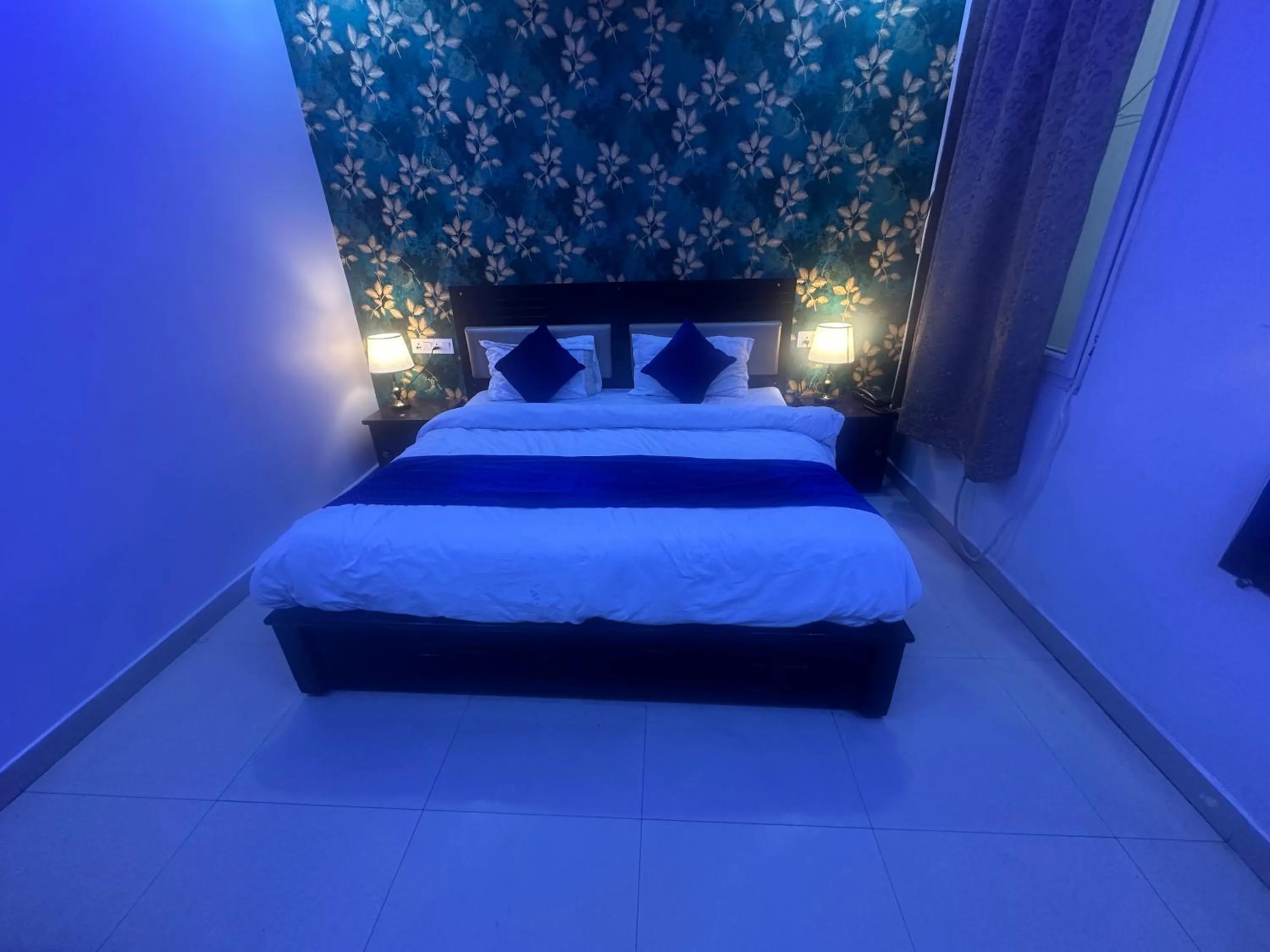 Bed in Blue Sky Hotels and Banquet