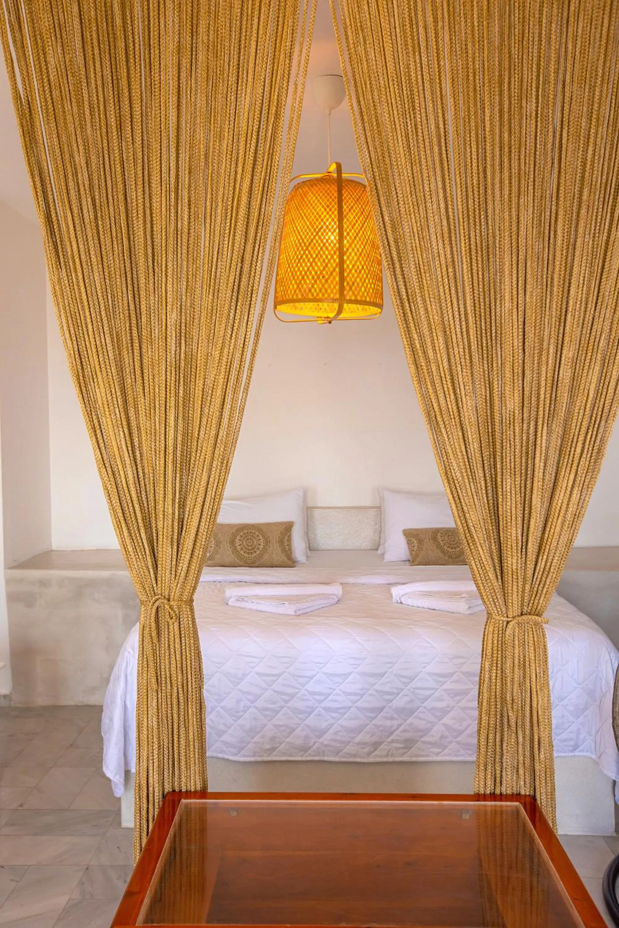 Bed in Phaos Santorini Suites