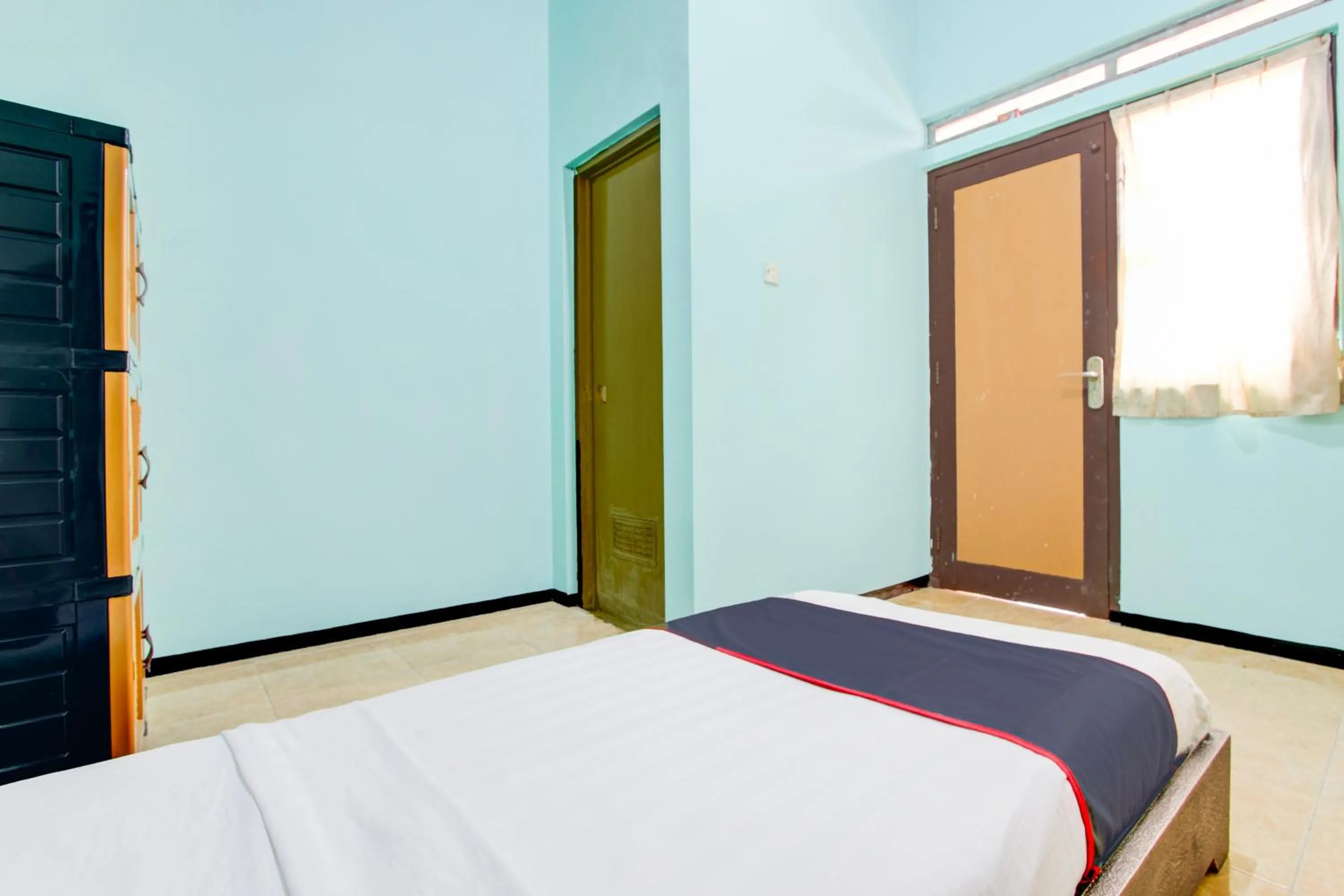 Bedroom, Bed in Hotel O Purwokerto Near Alun Alun Purwokerto Formerly Guest House Rania
