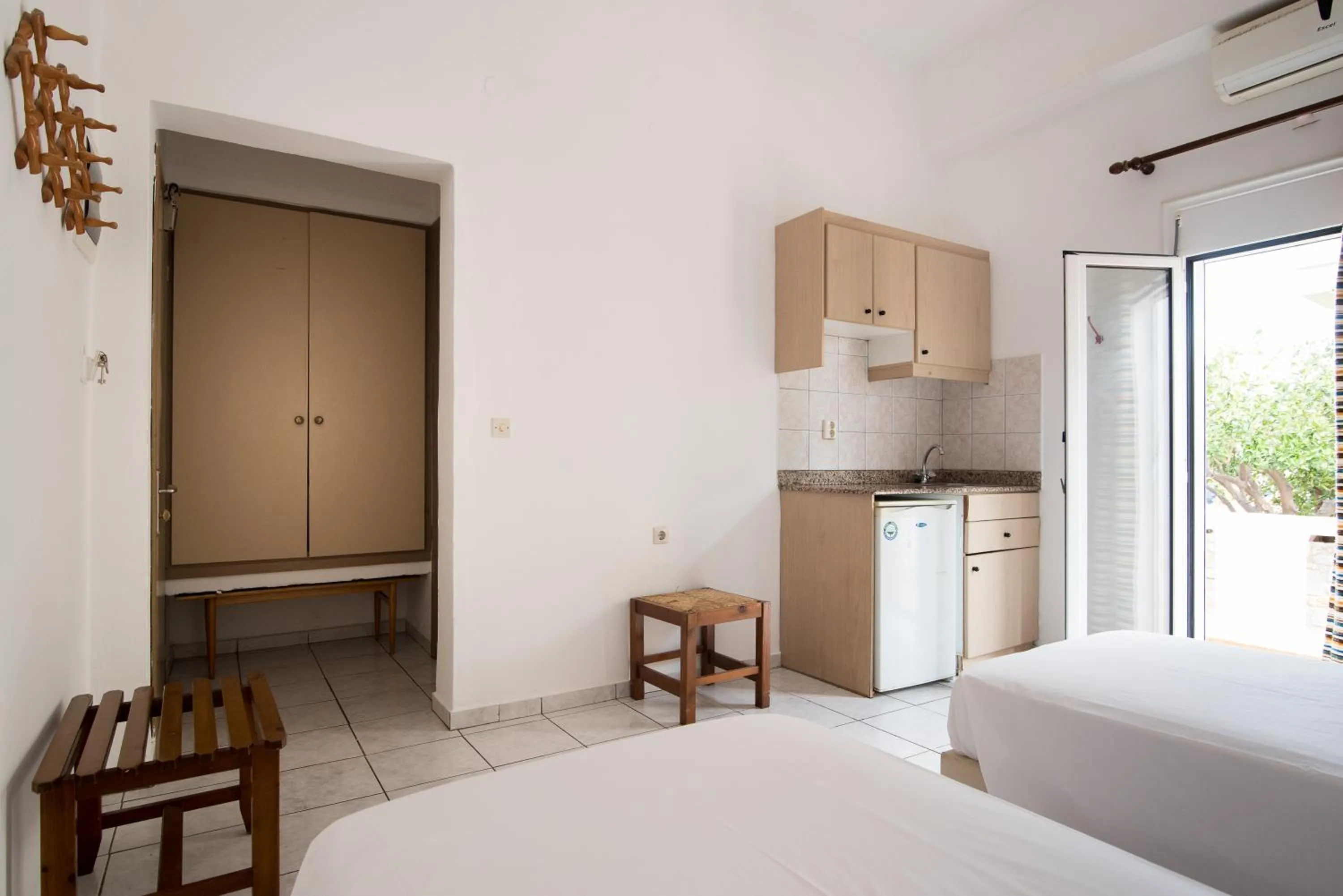 Kitchen or kitchenette, Bed in Ibiscus Hotel Malia