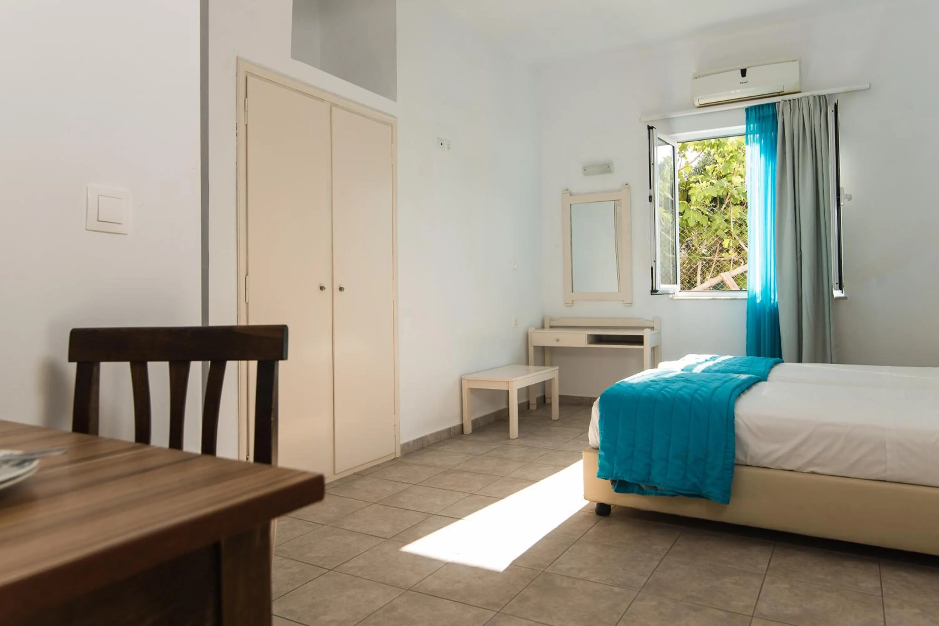 Dining area, Bed in Ibiscus Hotel Malia