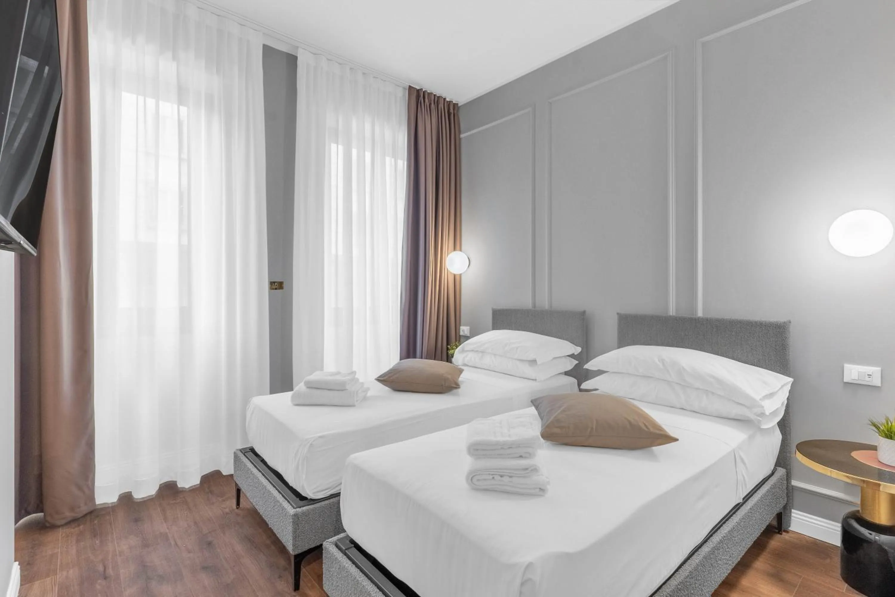 Bed in Torriani Suites Foresteria Lombarda
