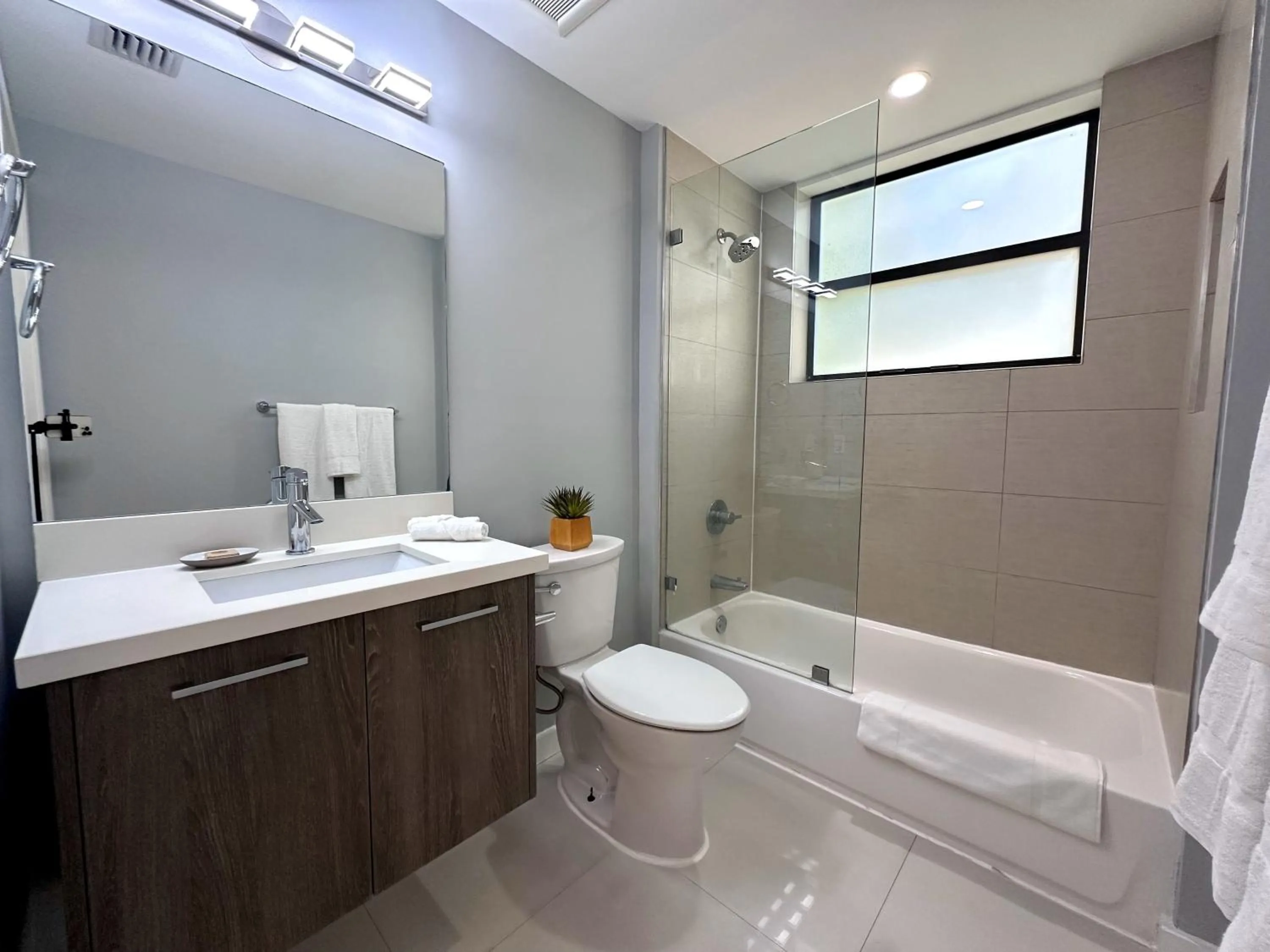 Shower in Bay Breeze Premium Apartments by Eskape Collection