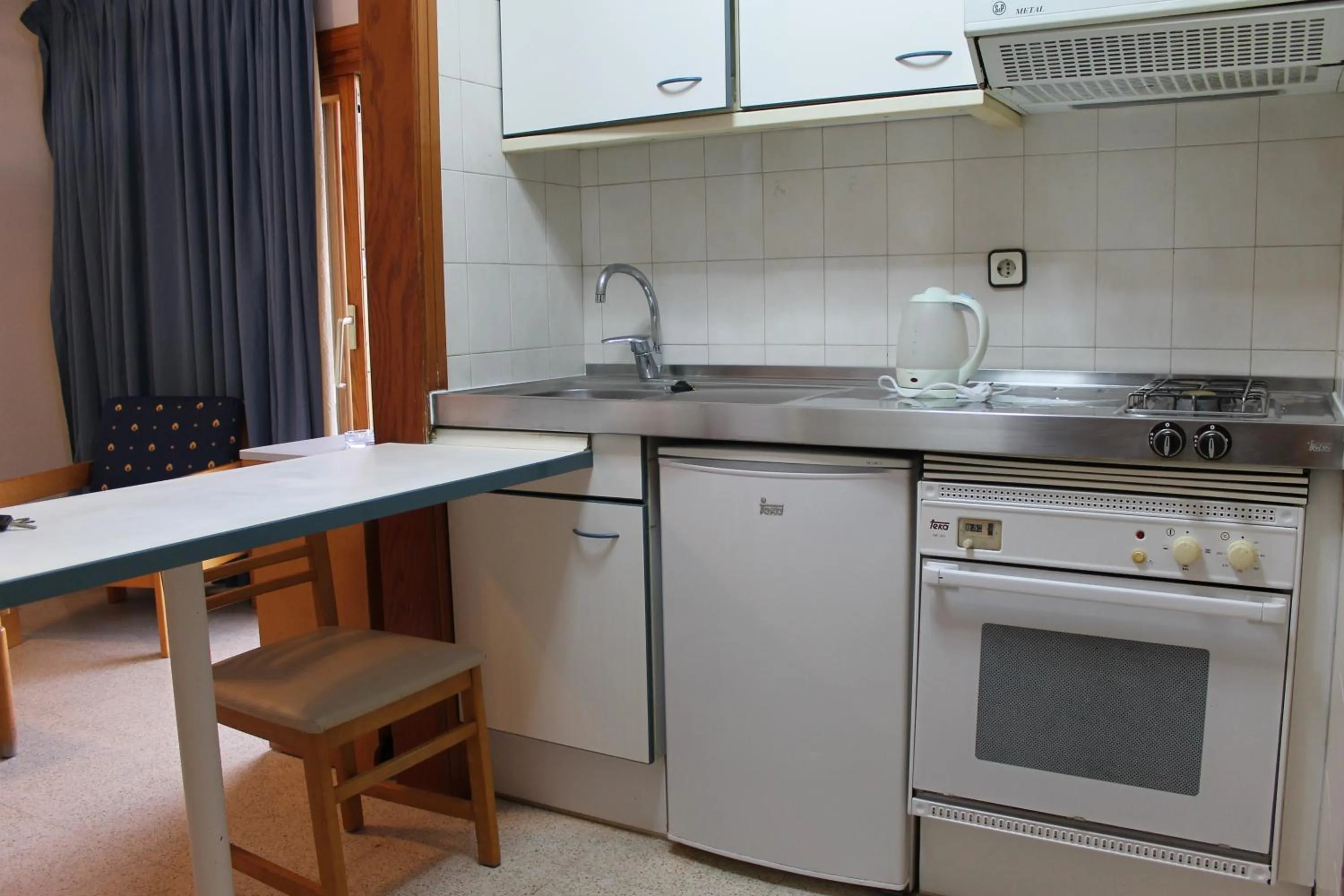 Kitchen or kitchenette in Apartamentos Alpha
