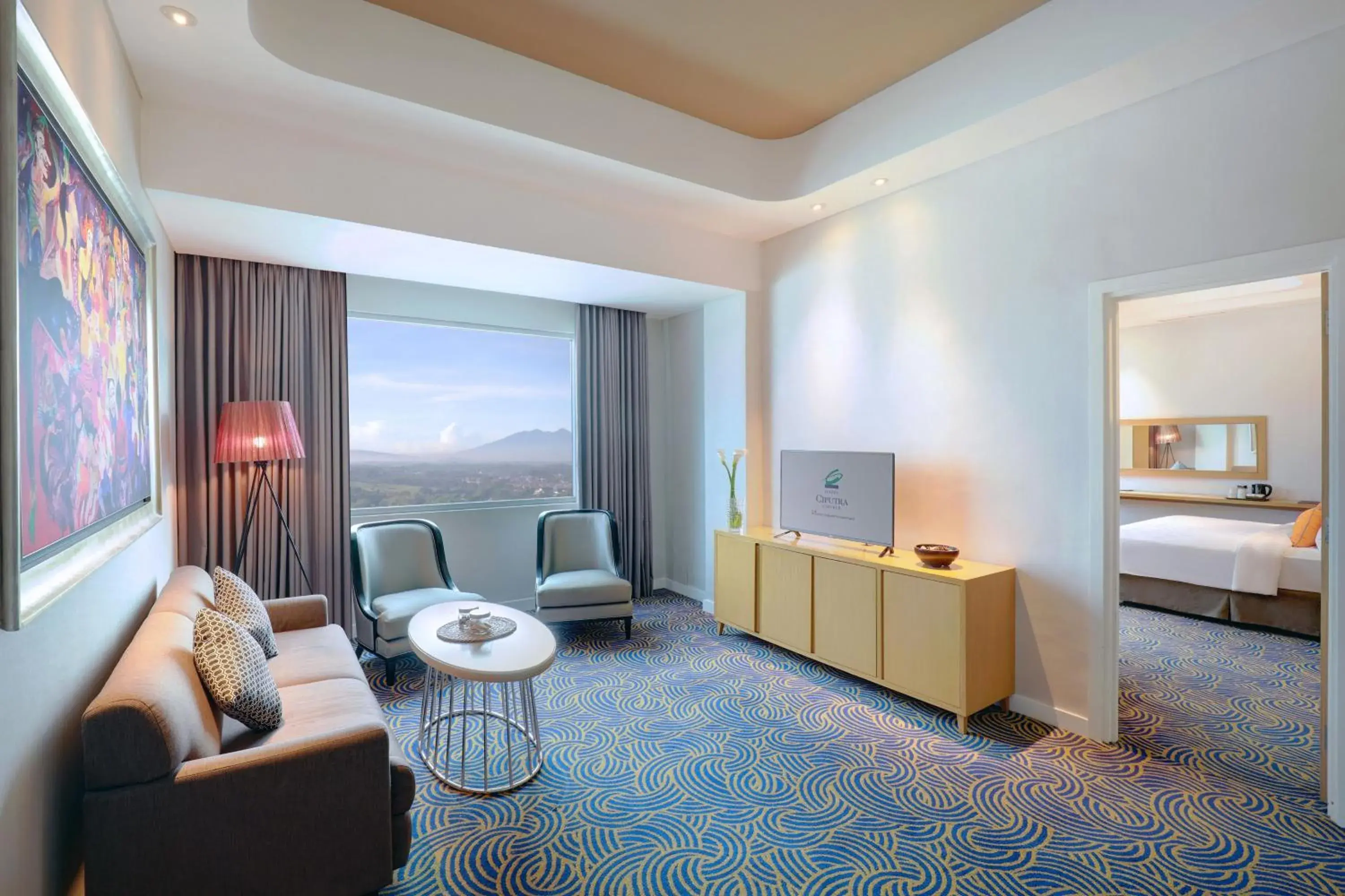 Living room, Bed in Hotel Ciputra Cibubur managed by Swiss-Belhotel International Living room, Bed in Hotel Ciputra Cibubur managed by Swiss-Belhotel International