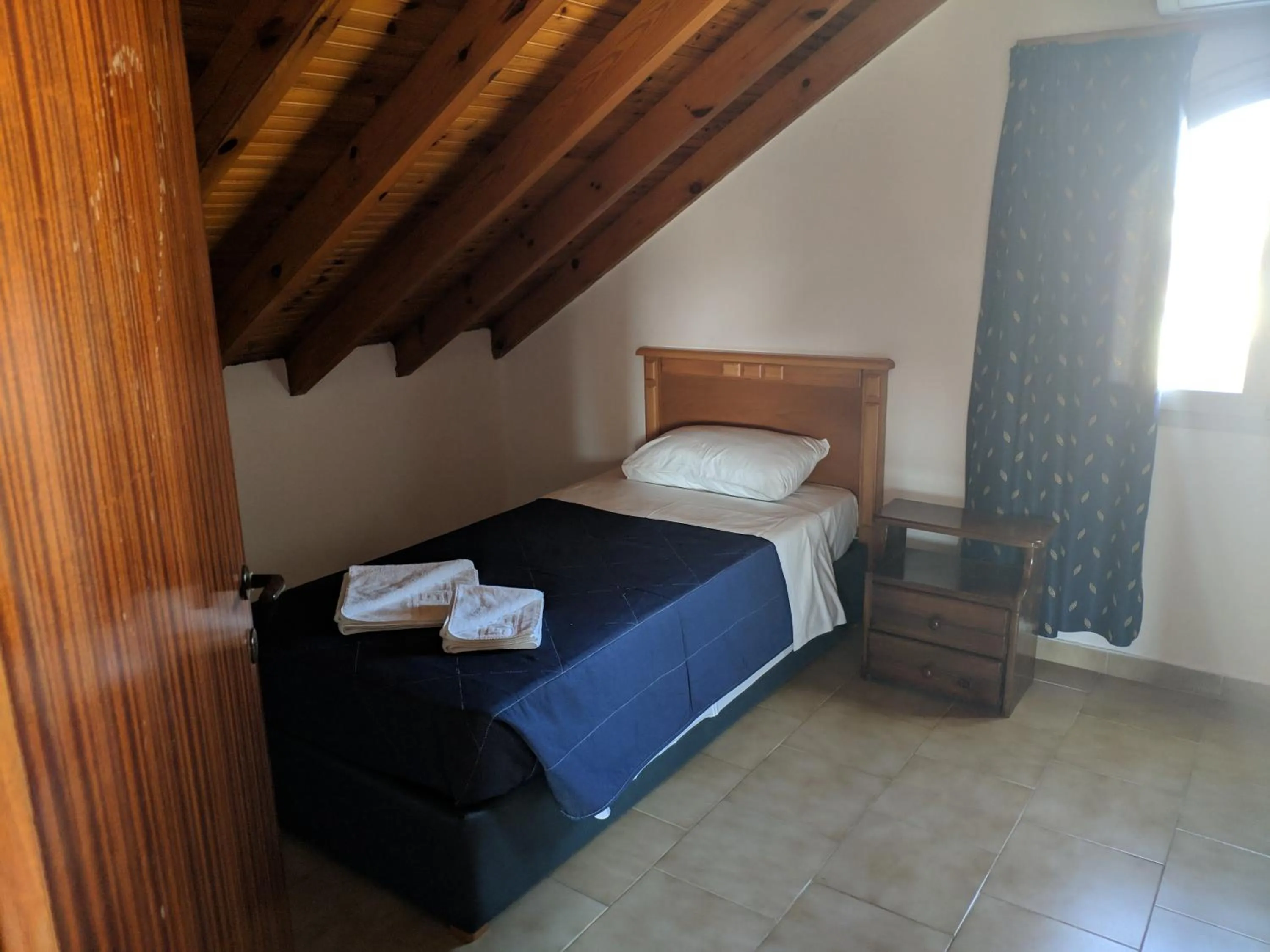 Bed in Tondoris Apartments