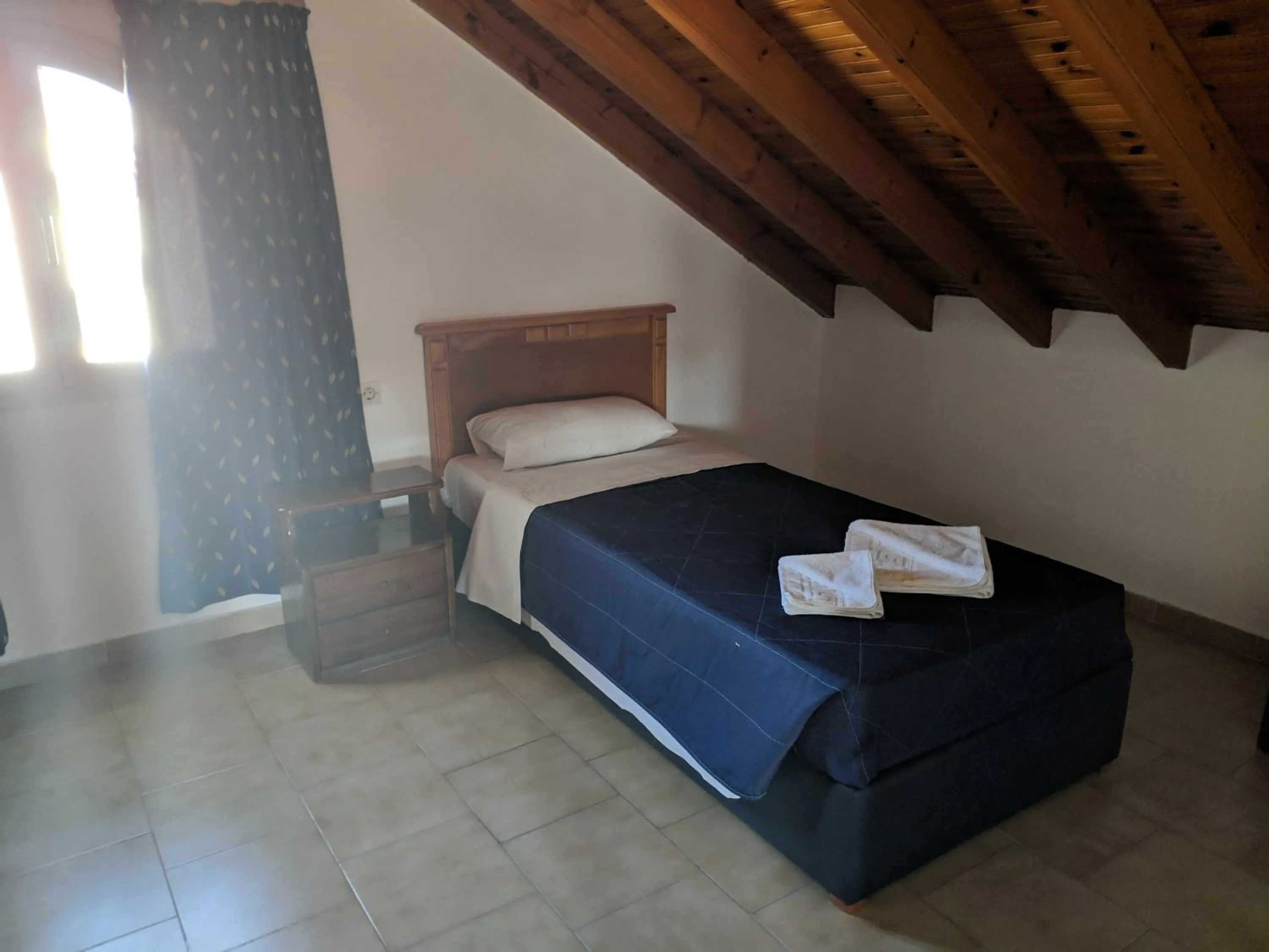 Bed in Tondoris Apartments