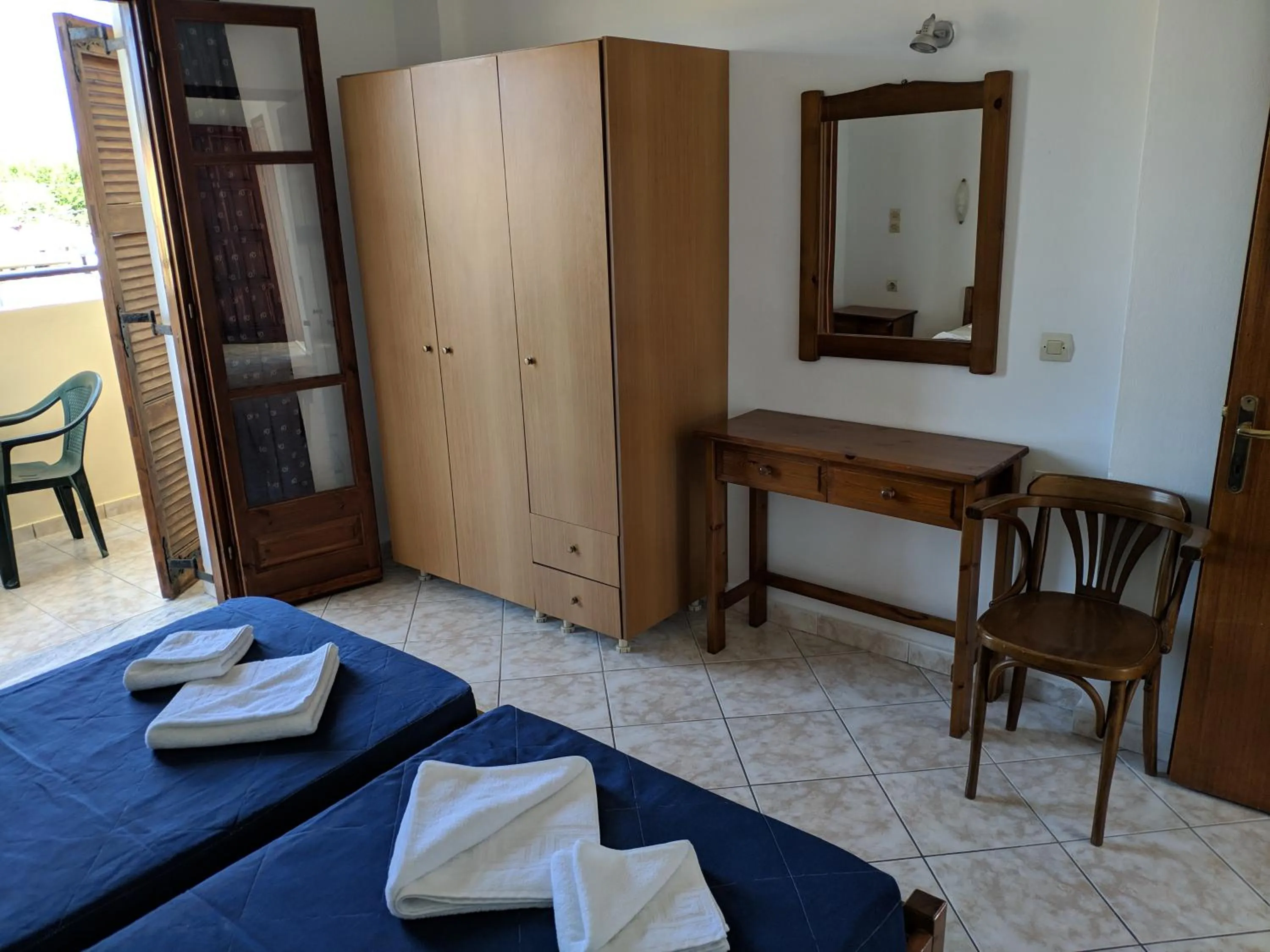 Bed in Tondoris Apartments