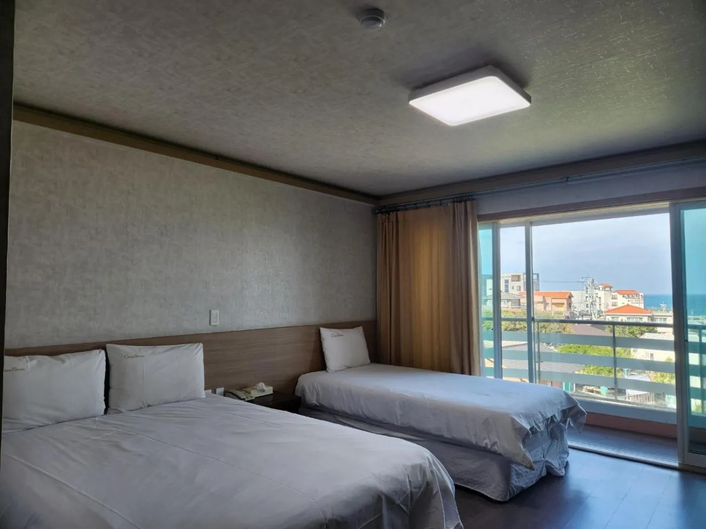 Bed in Jeju Ocean Family Hotel