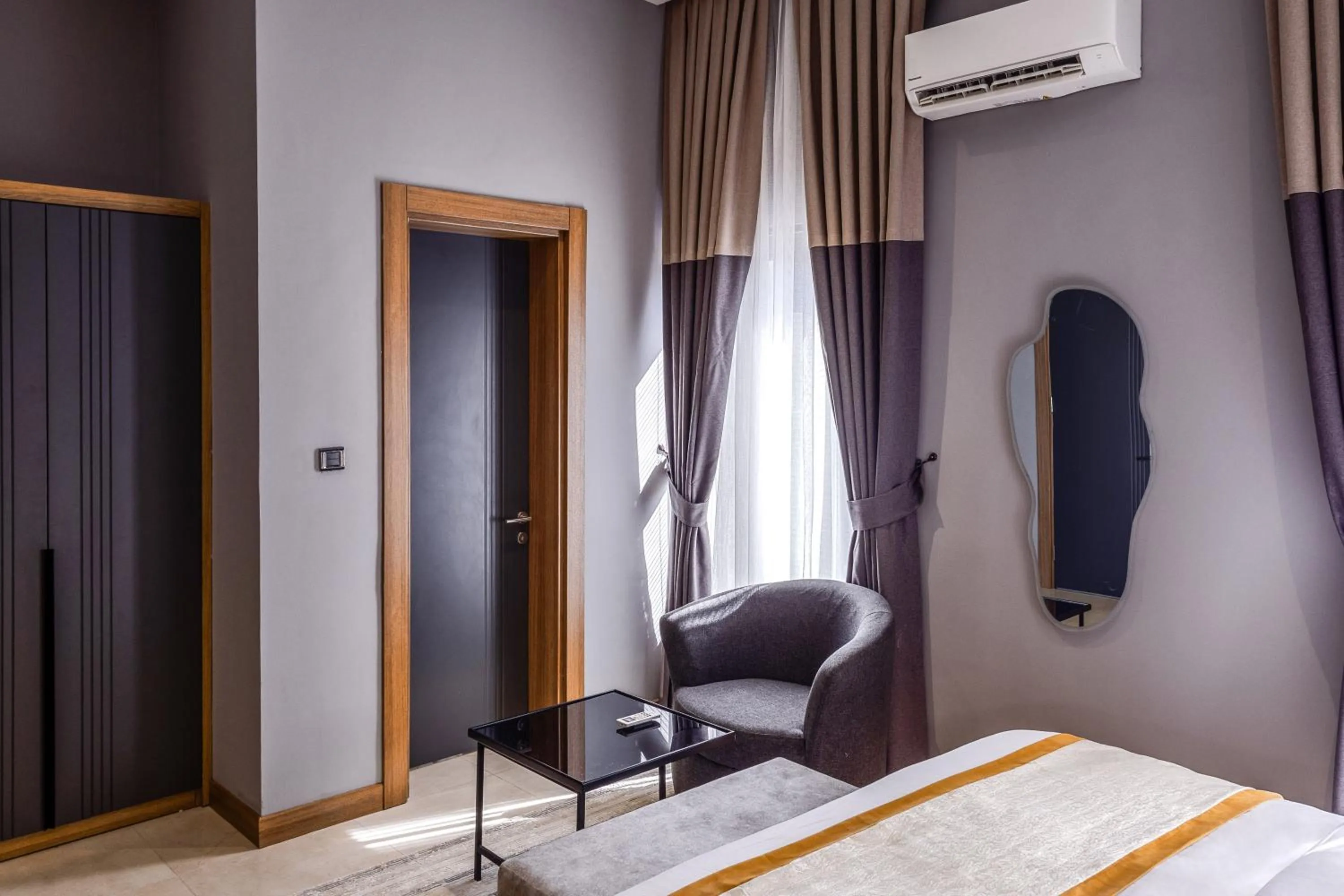 Seating area, Bed in Yellow Trumpet Wuse 2