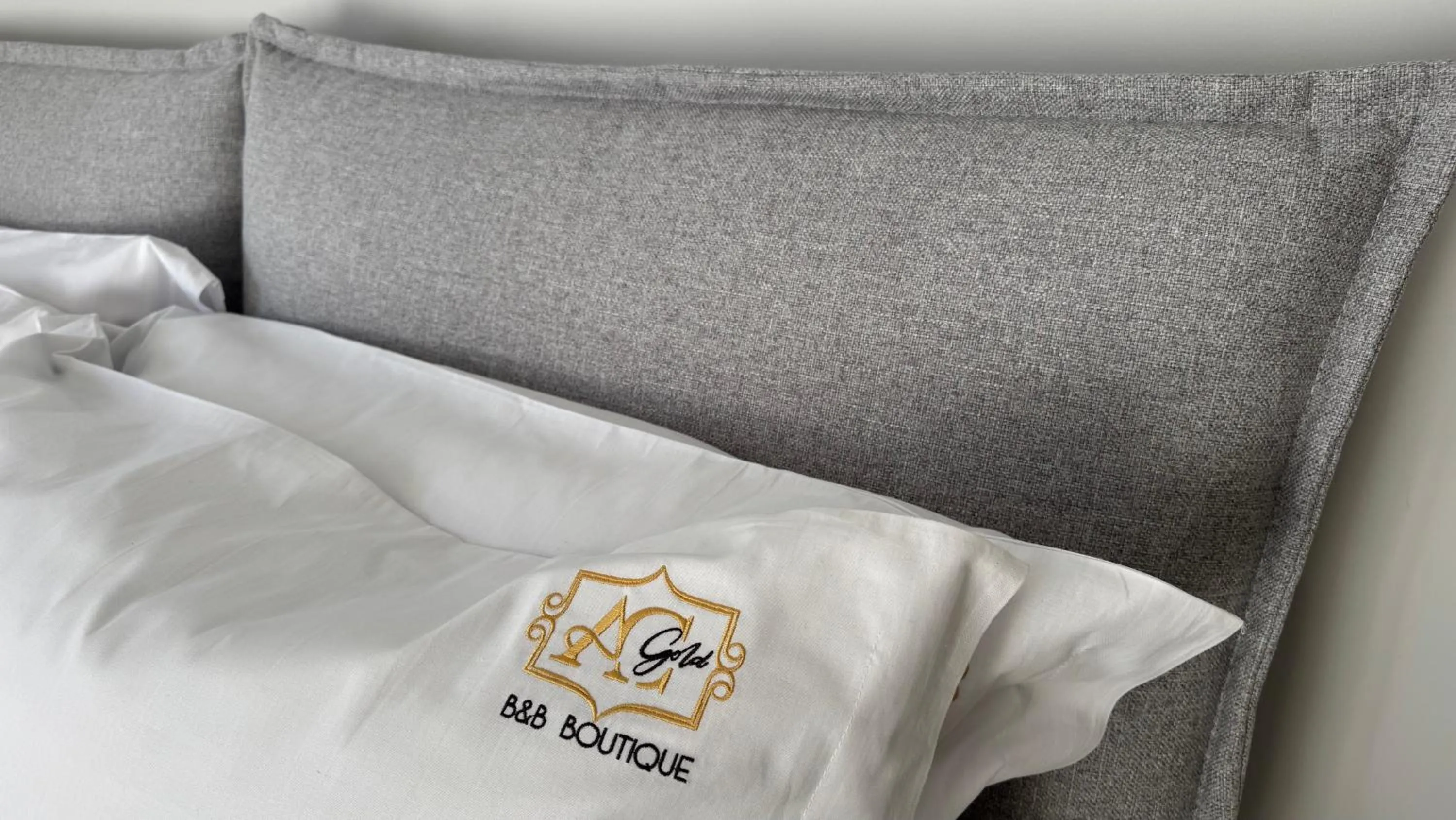 Bed in AC GOLD B&B Boutique Rooms & Suite