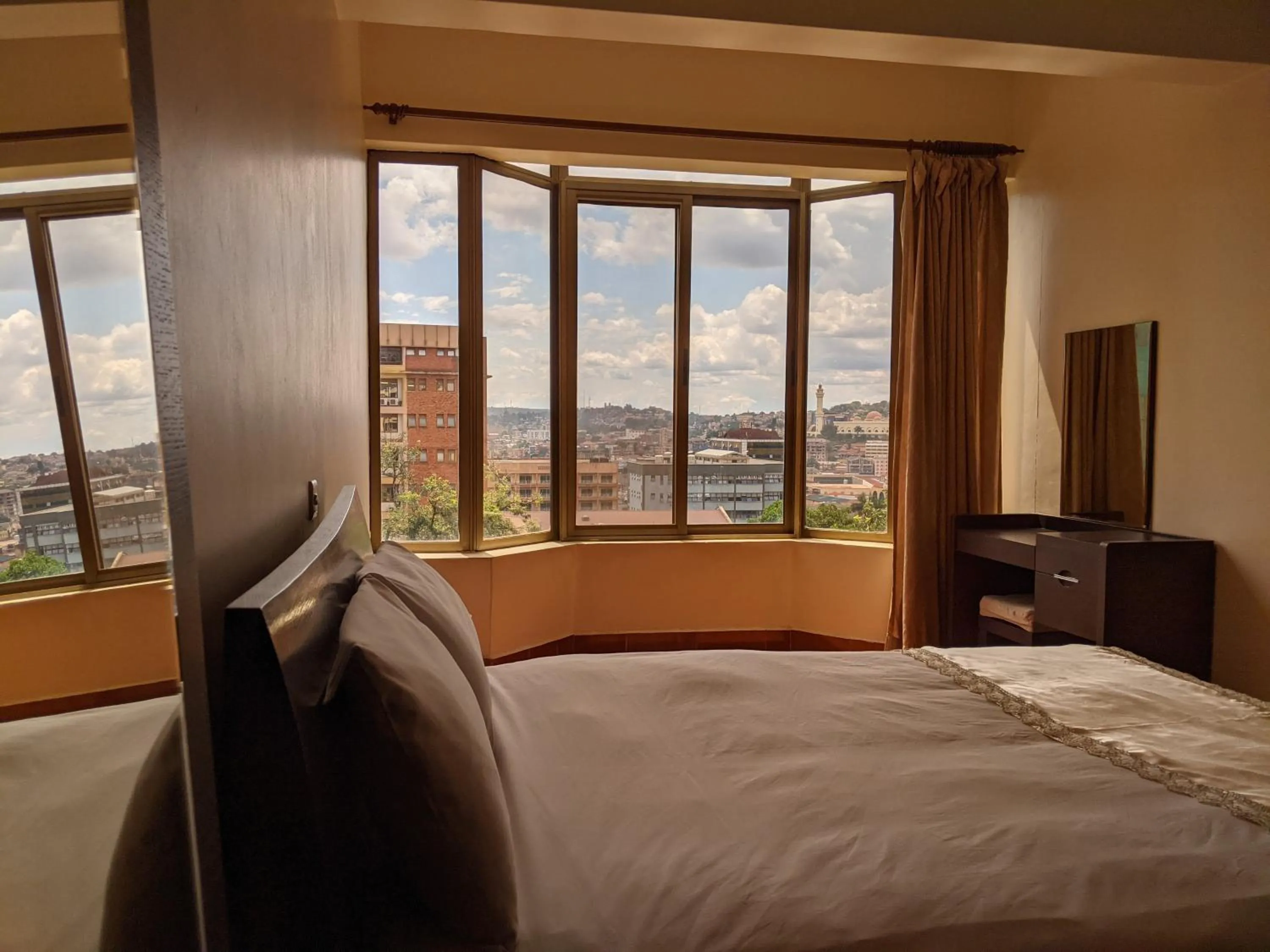 Bed in Prestige Hotel Suites