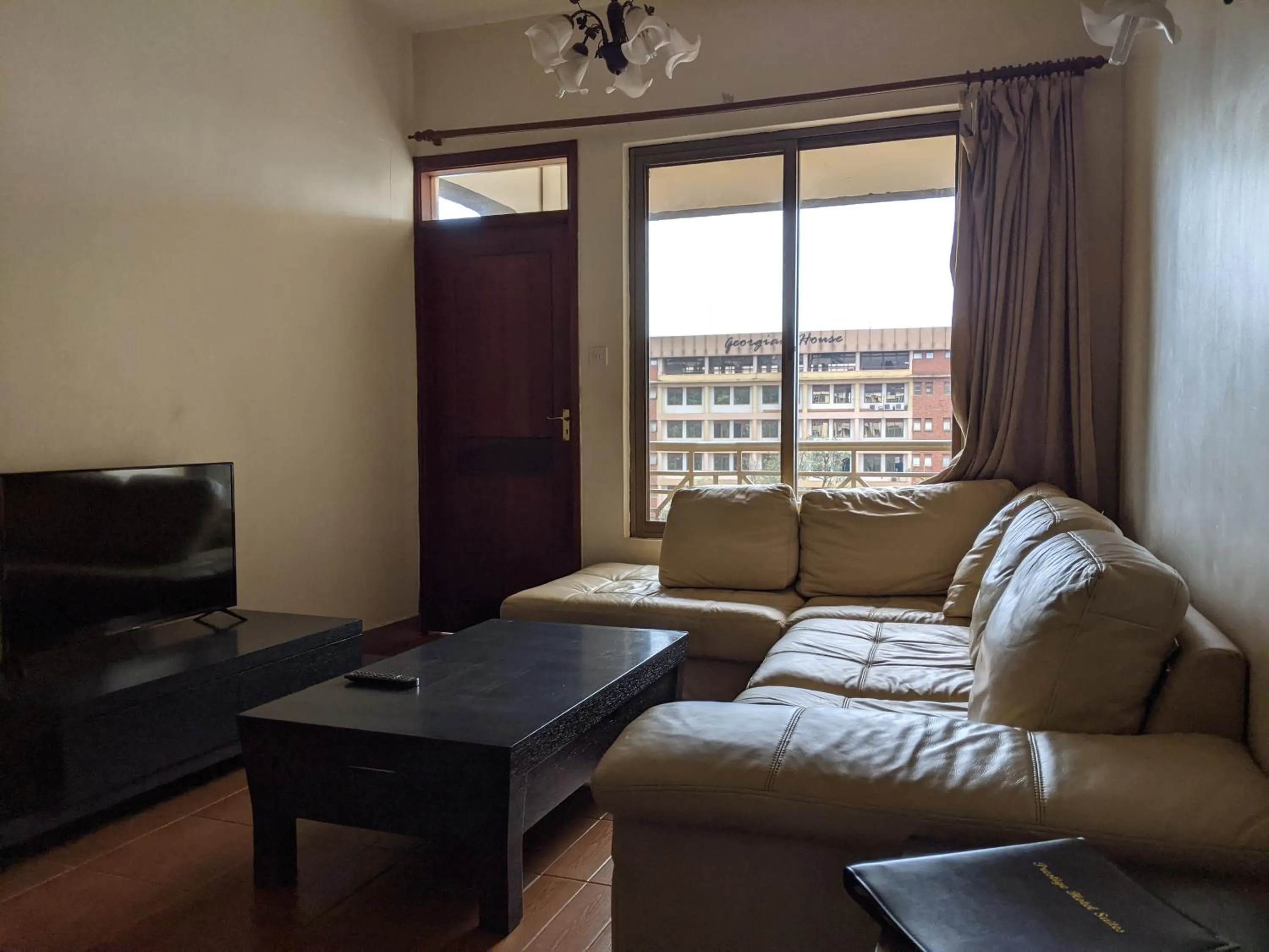 Living room, Bed in Prestige Hotel Suites