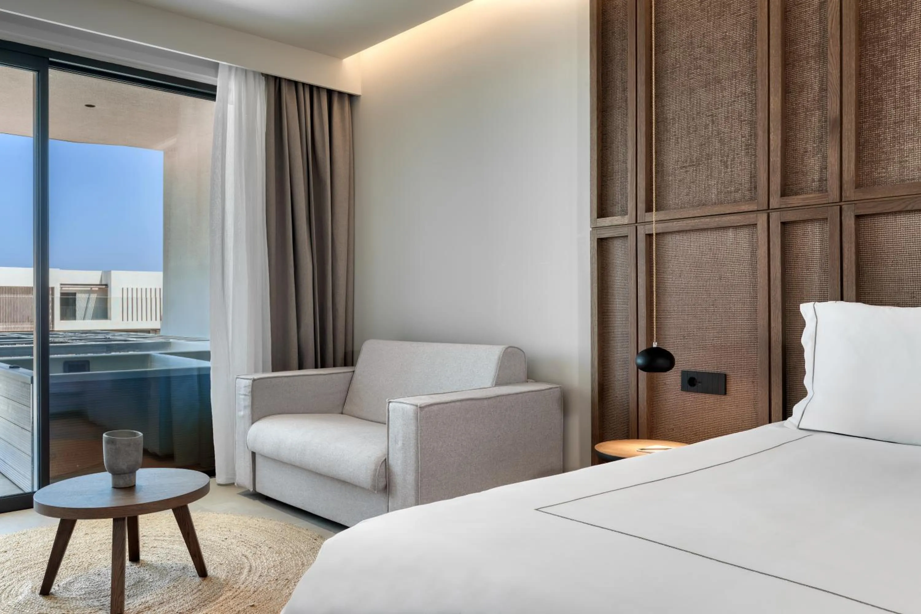 Seating area, Bed in Mosay All Suite Hotel