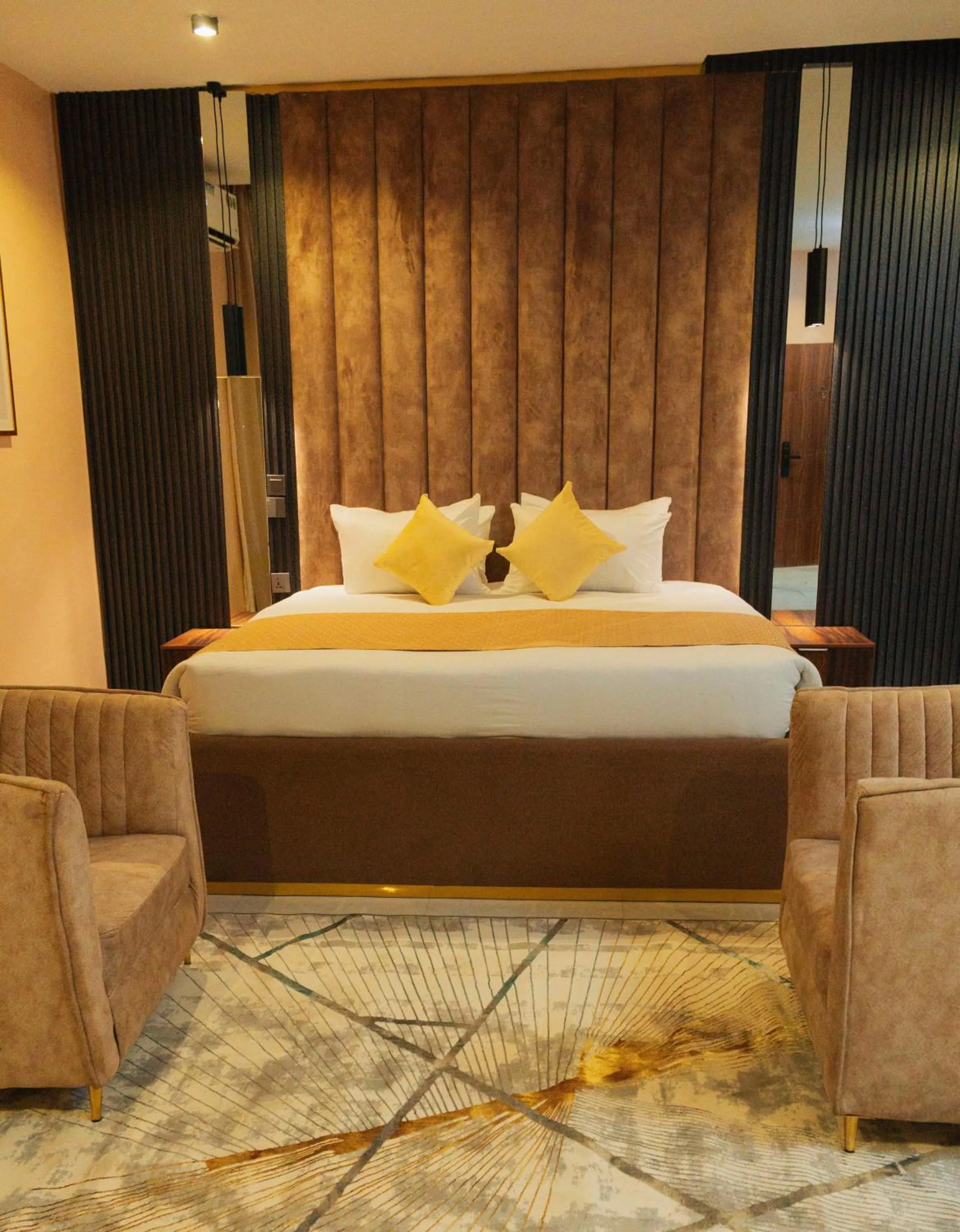 Bedroom in The Manor Hotel by Luckzi