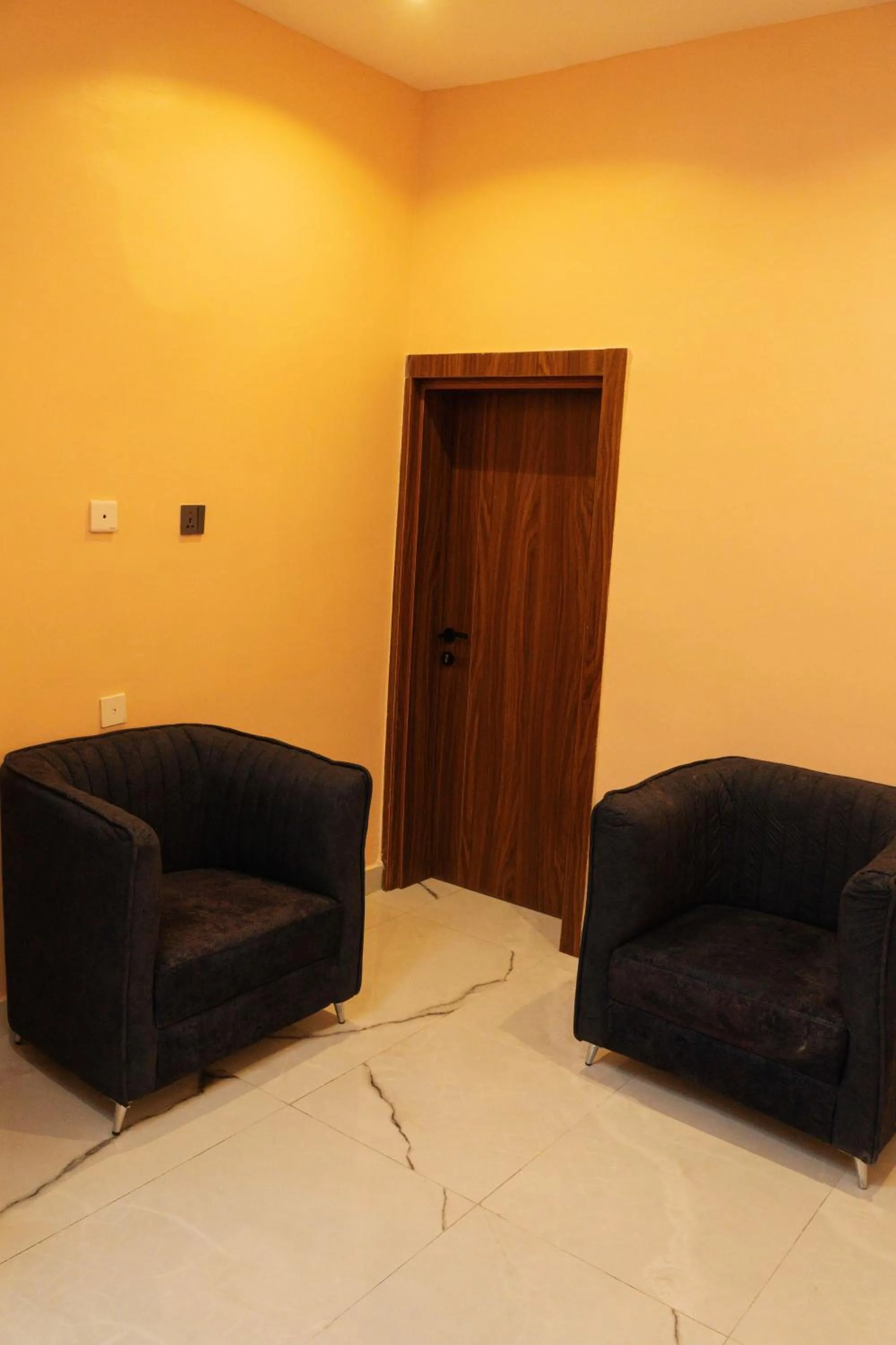 Seating area in The Manor Hotel by Luckzi
