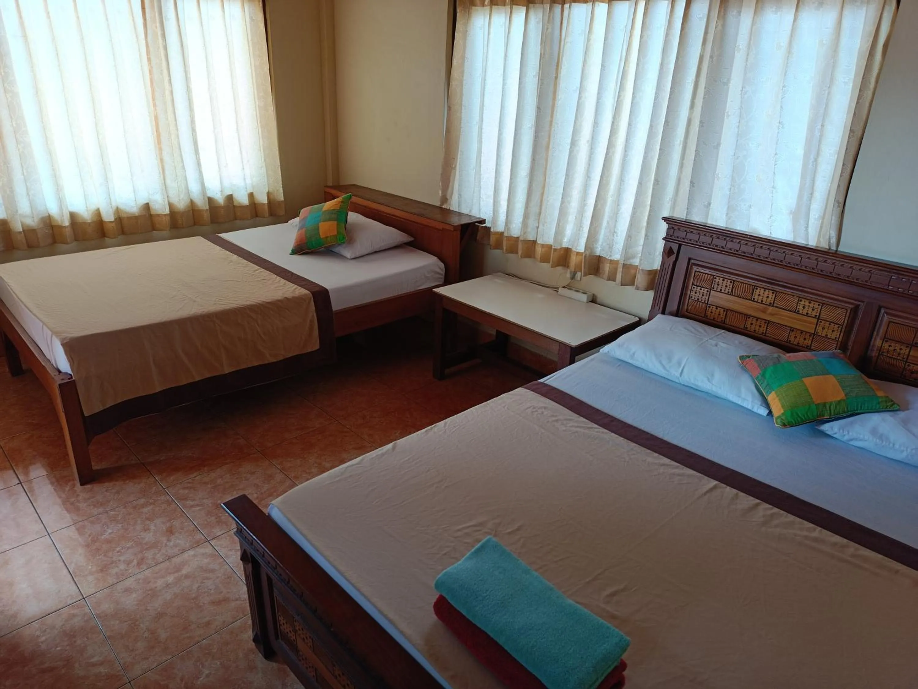 Bed in Nyoman House Ubud