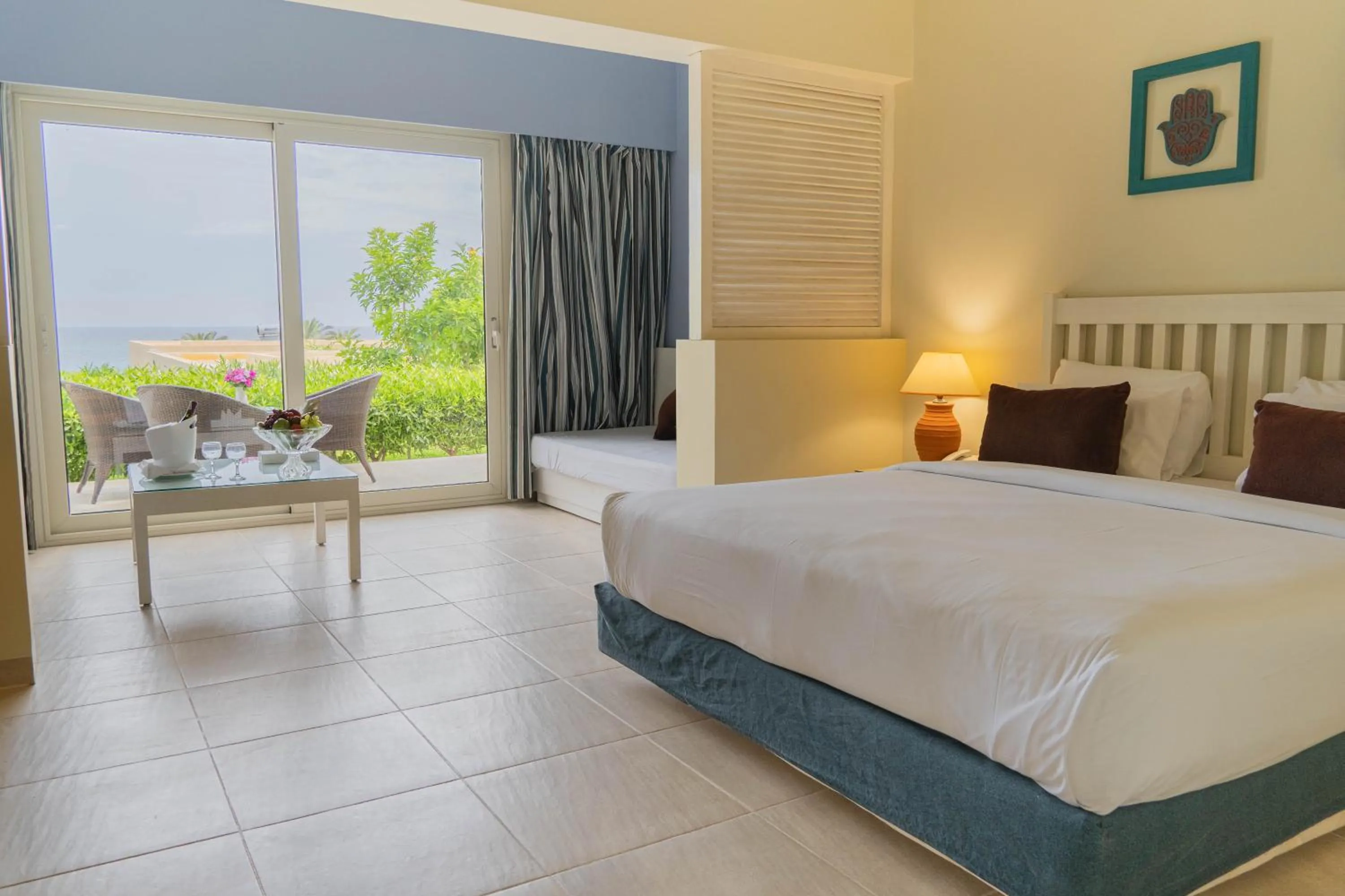 Seating area, Bed in Caesar Bay Resort