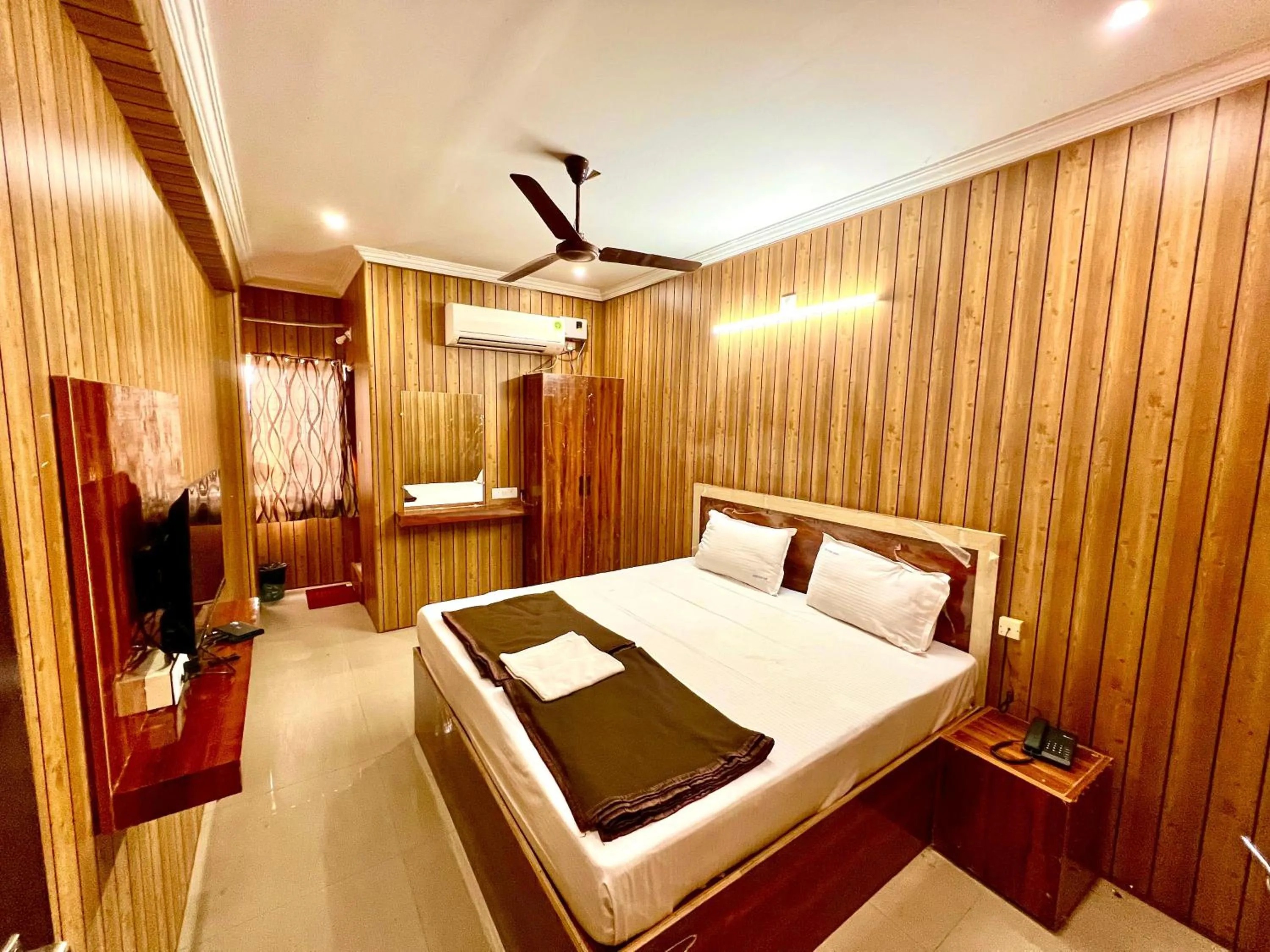 Bed in Hotel Govindh Heights