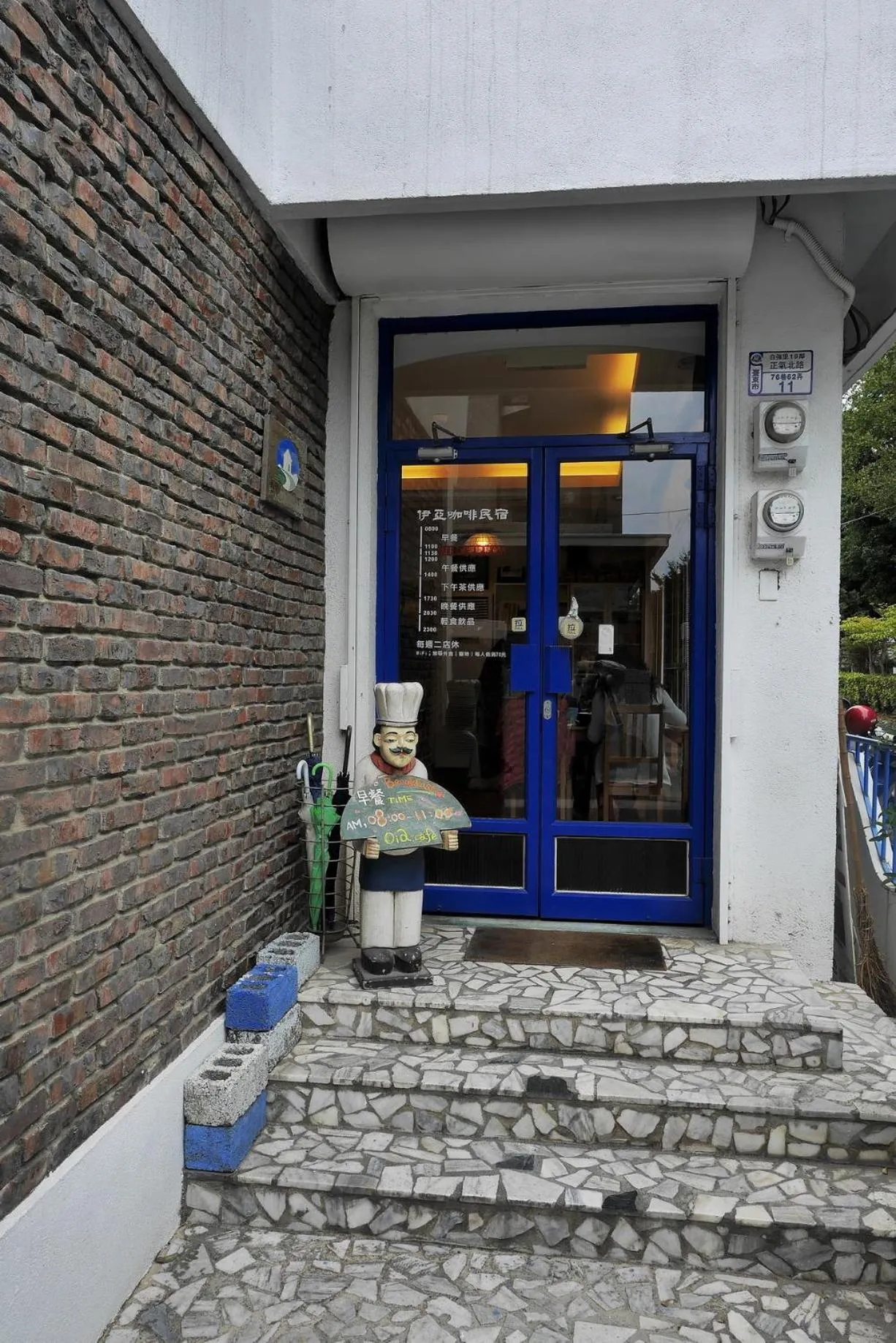 Facade/entrance in Oia Cafe B&B