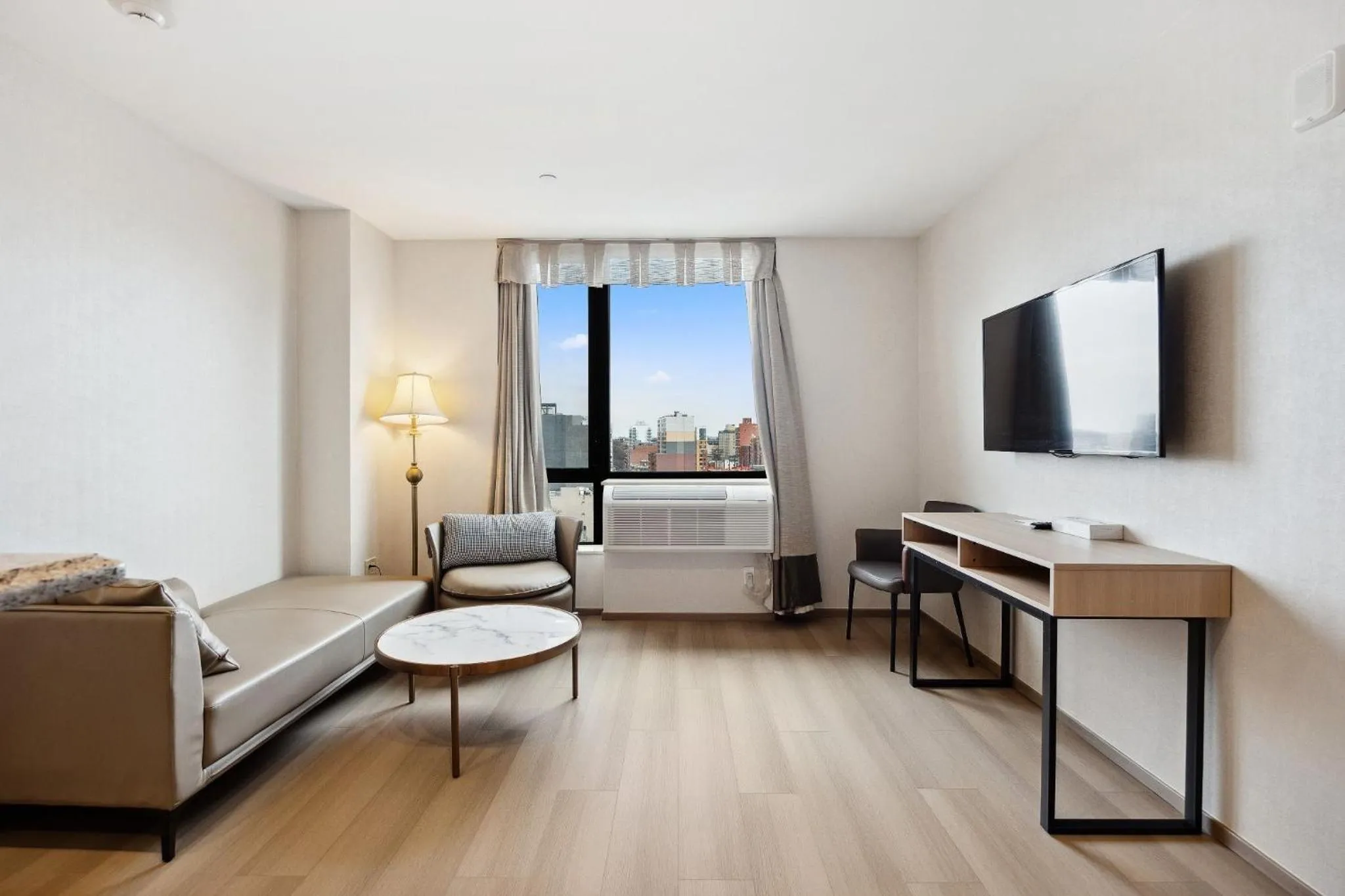 Living room in Ramada by Wyndham Flushing Queens