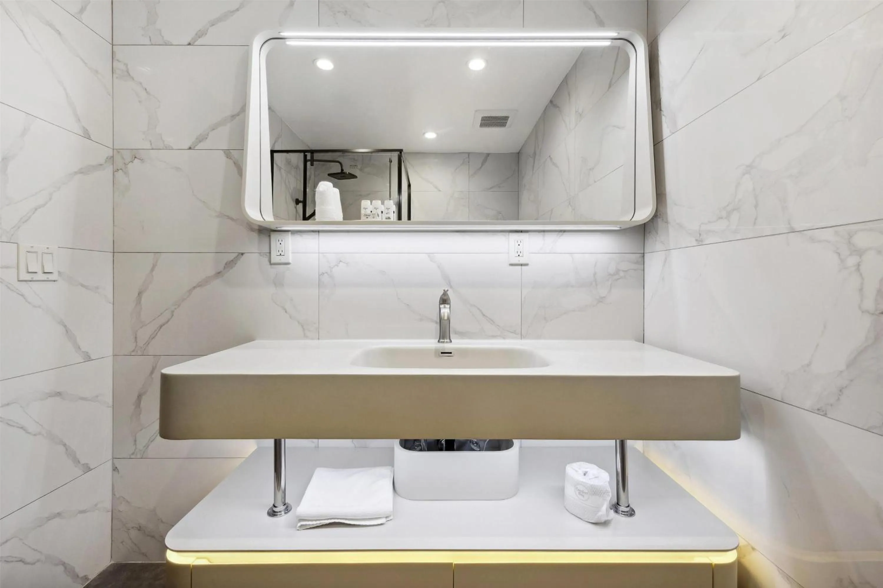 Bathroom in Ramada by Wyndham Flushing Queens