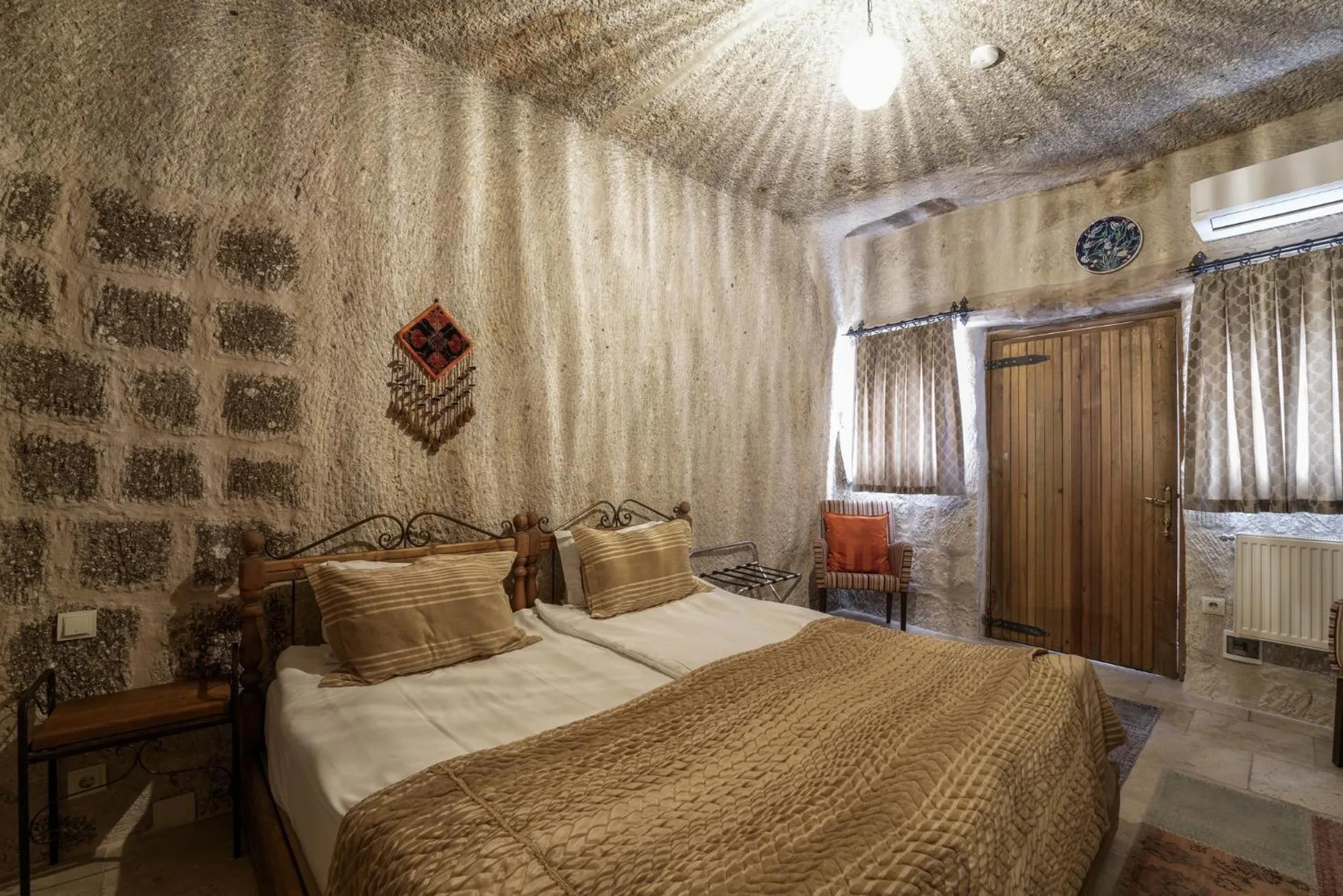 Bed in Tekkaya Cave Hotel