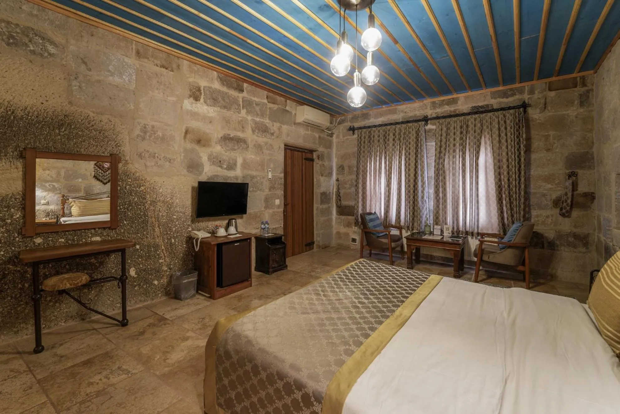 Bed in Tekkaya Cave Hotel