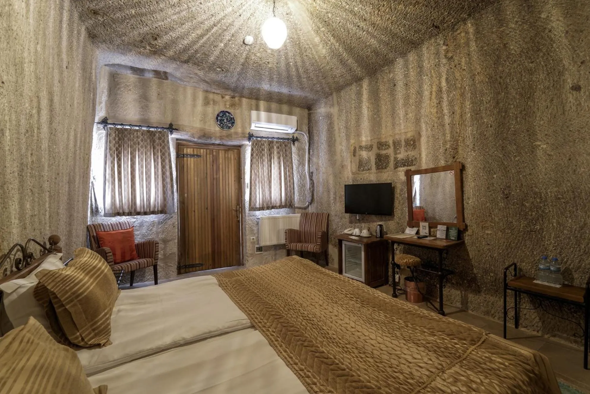 Bed in Tekkaya Cave Hotel